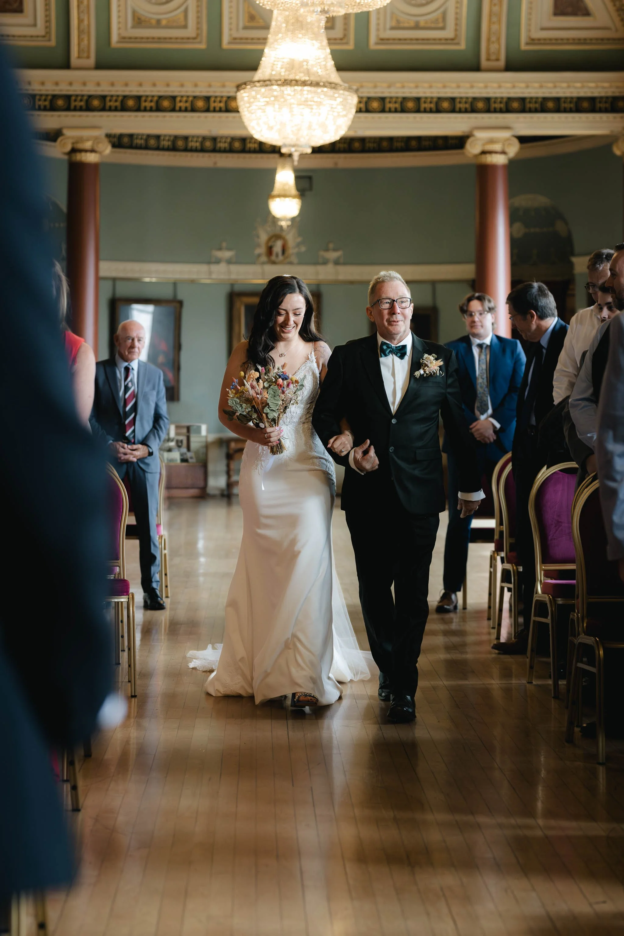  Bride and her Dad walking down the aisle at Worcester Guildhall wedding. 