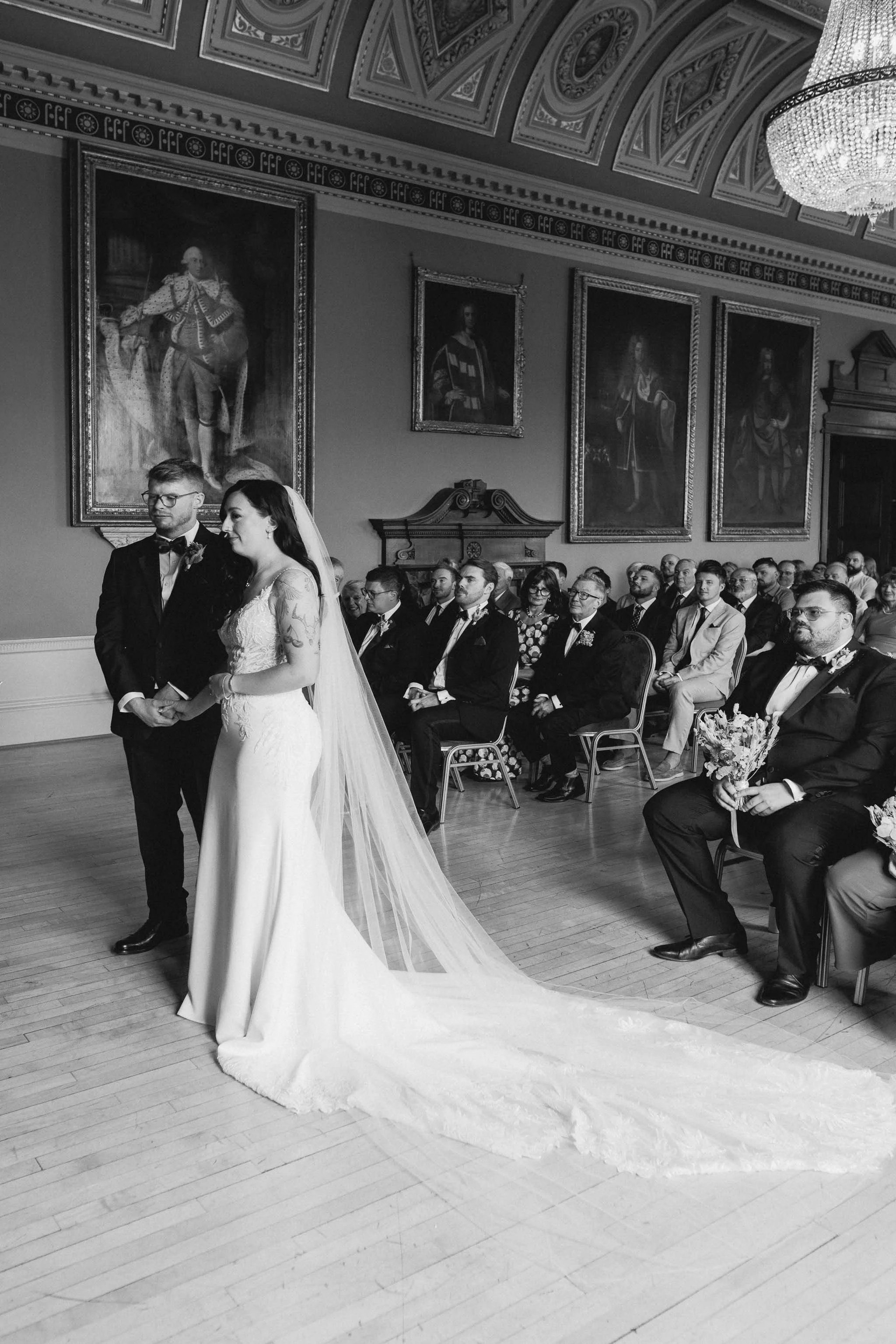  Bride and groom during vows at wedding ceremony in Worcester Guildhall. 
