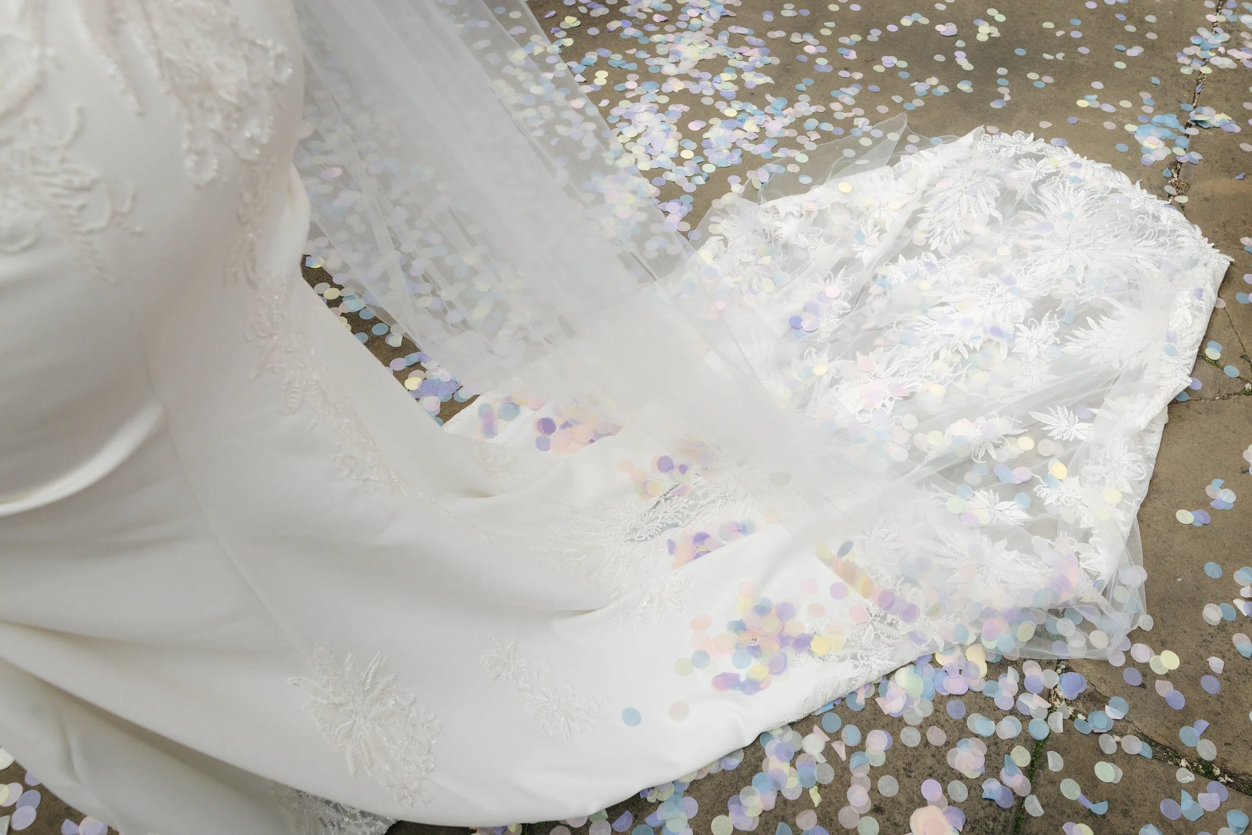 Confetti on train of bride’s dress. 