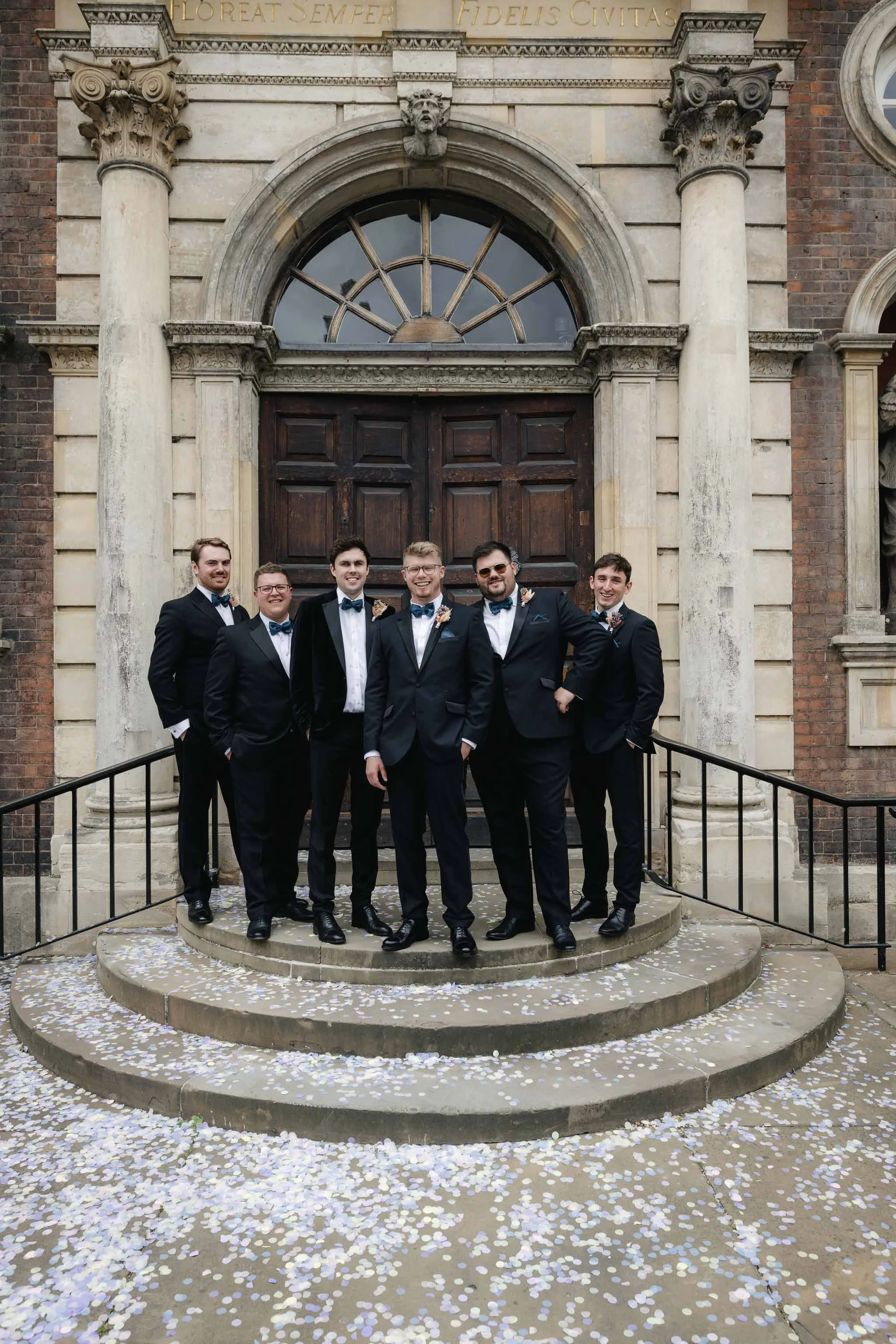 Groom and groomsmen editorial group shot on steps outside Worcester Guildhall. 