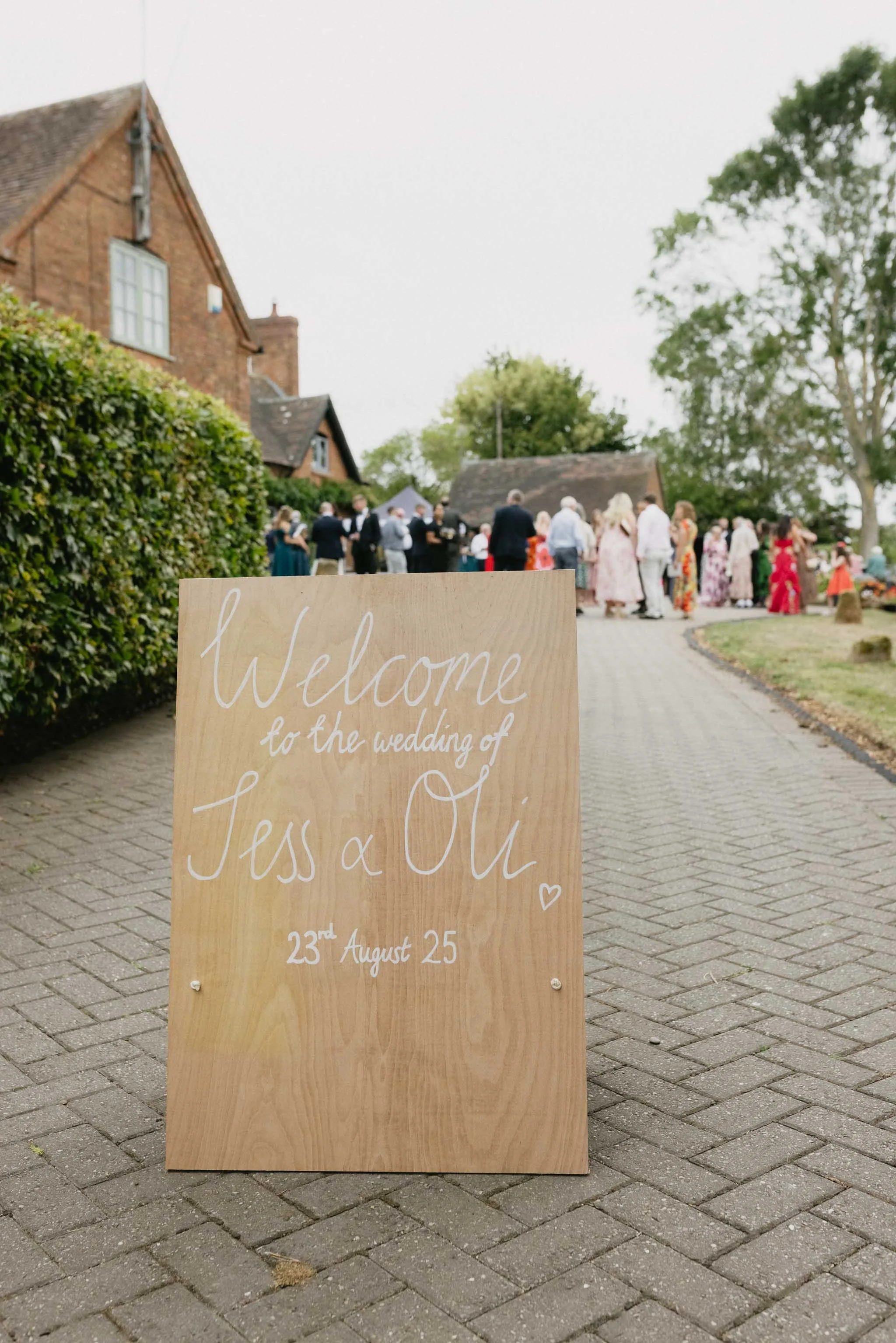  Wedding welcome sign at a marquee wedding reception at home. 