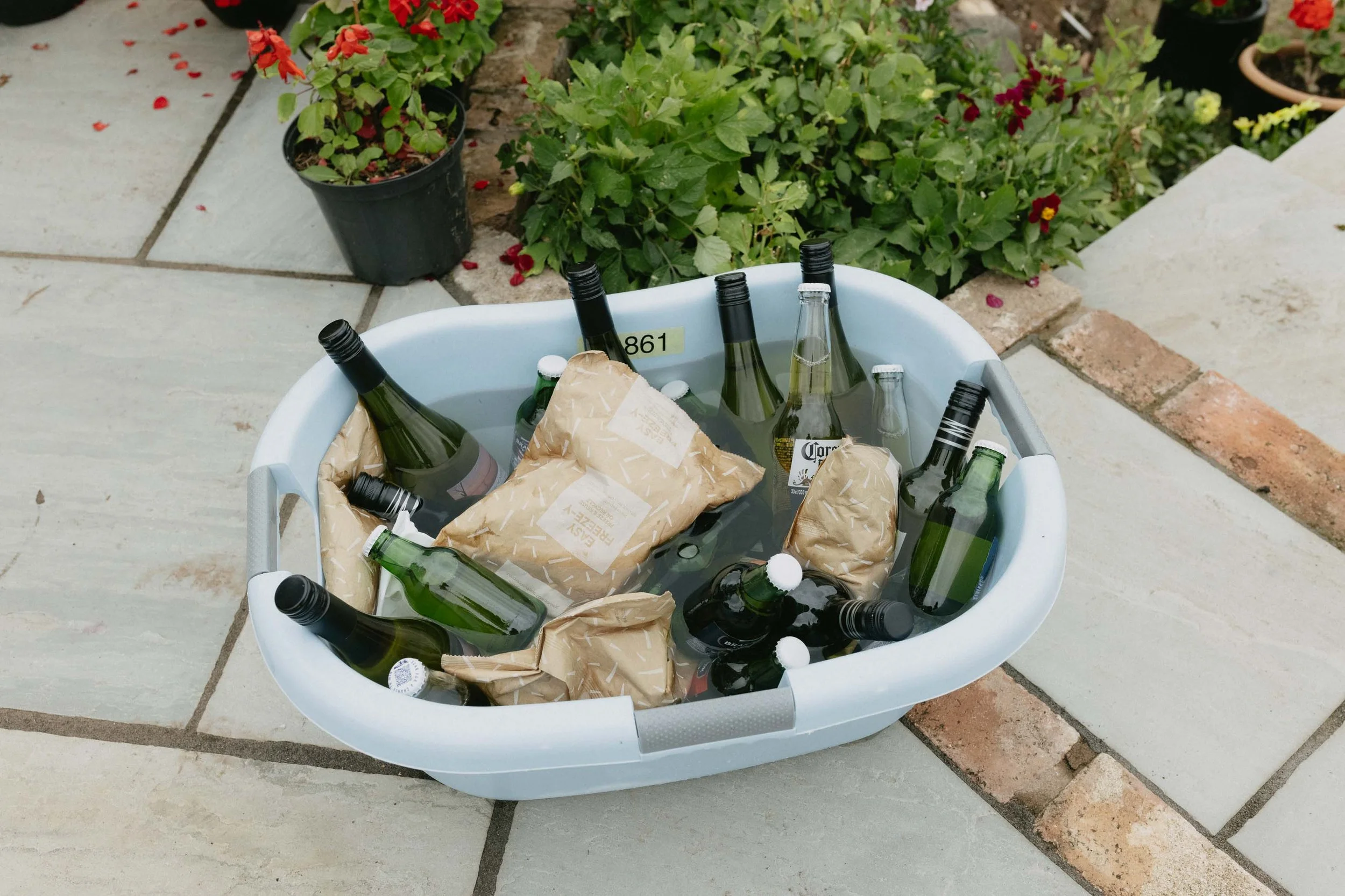  Bottles of beer in an ice bath at a backyard wedding reception in Worcester. 