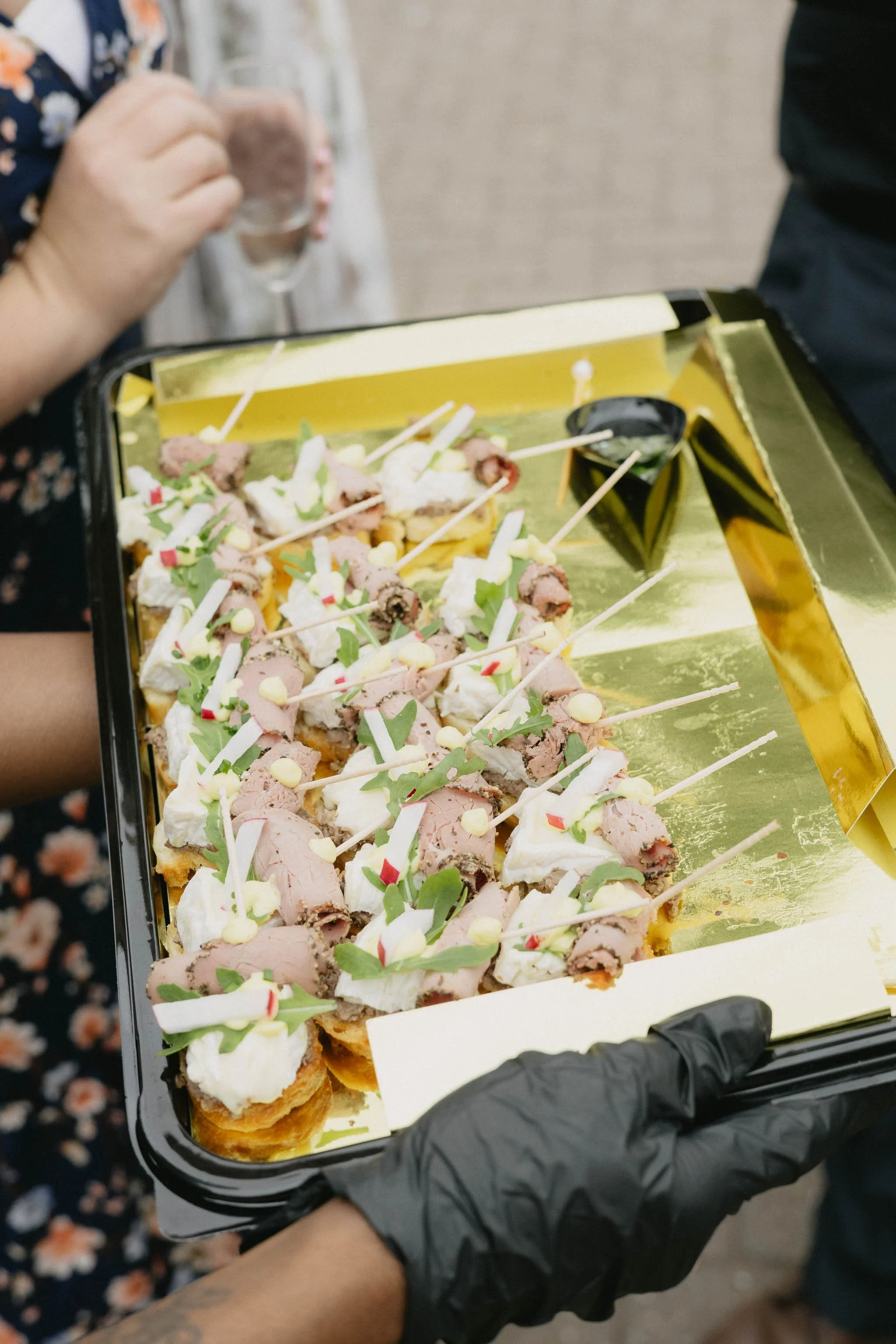  Guests enjoying Eat Greek catering at marquee wedding reception. 