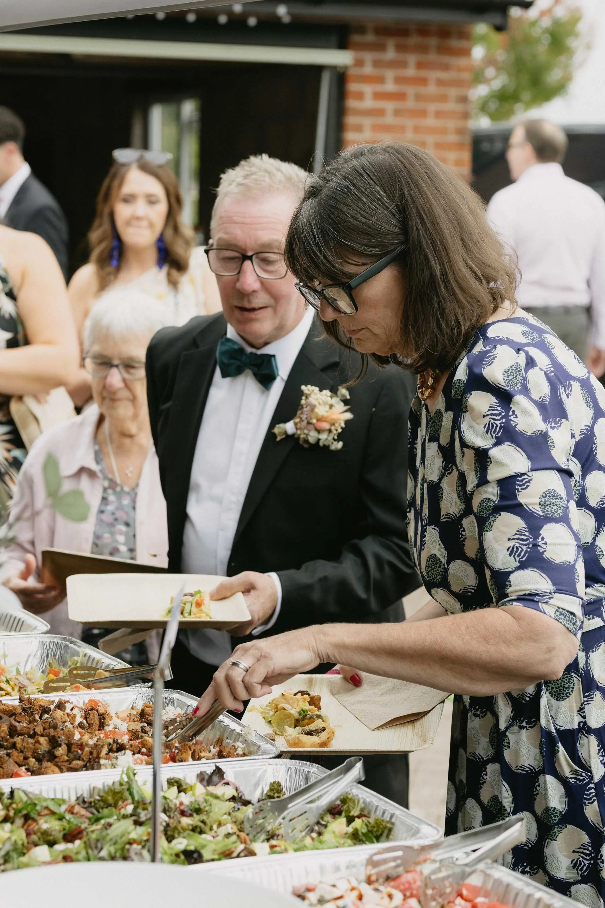  Wedding guests enjoying for by Eat Greek at a home wedding reception in Worcester. 
