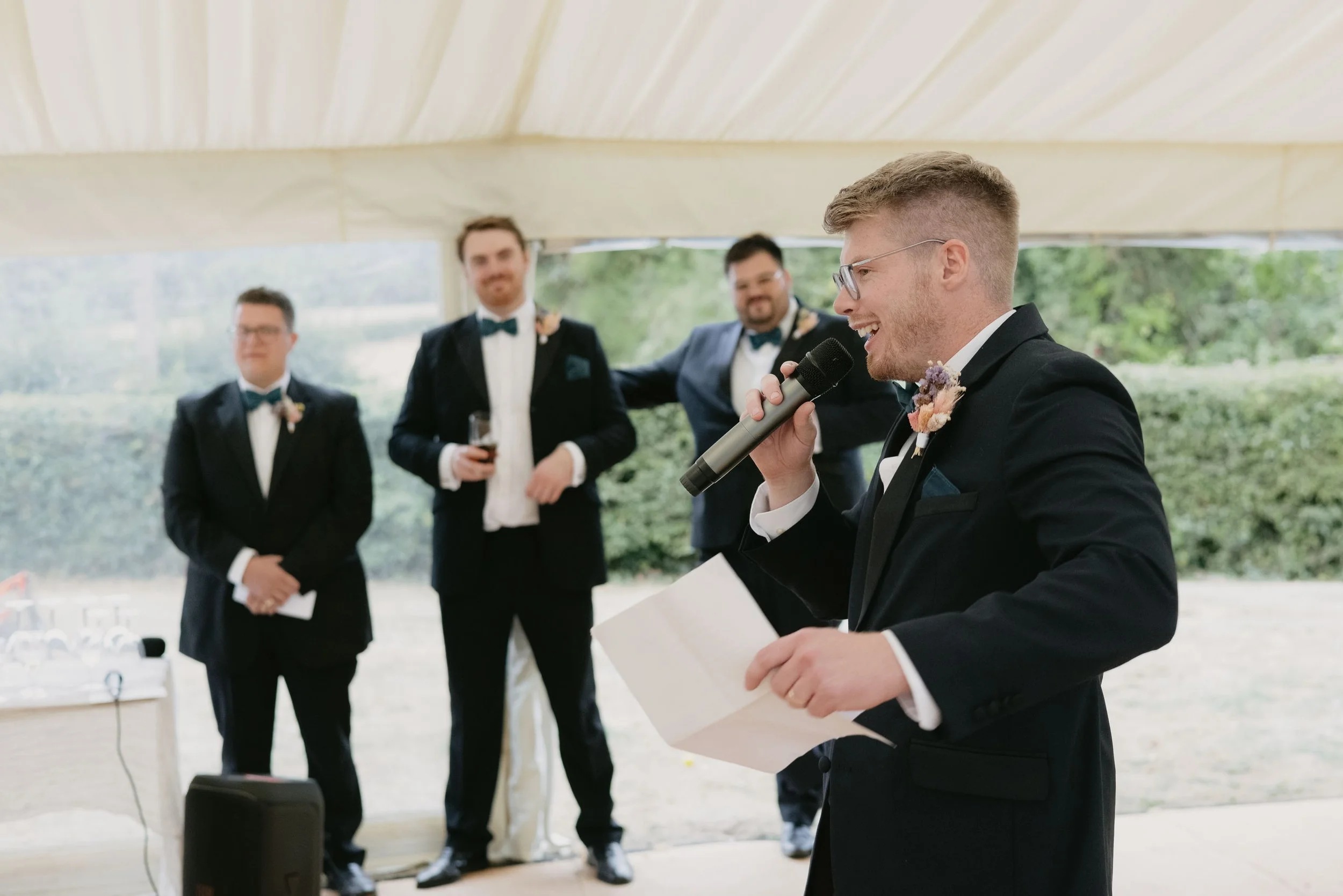  Groom giving a wedding speech in a marquee.  