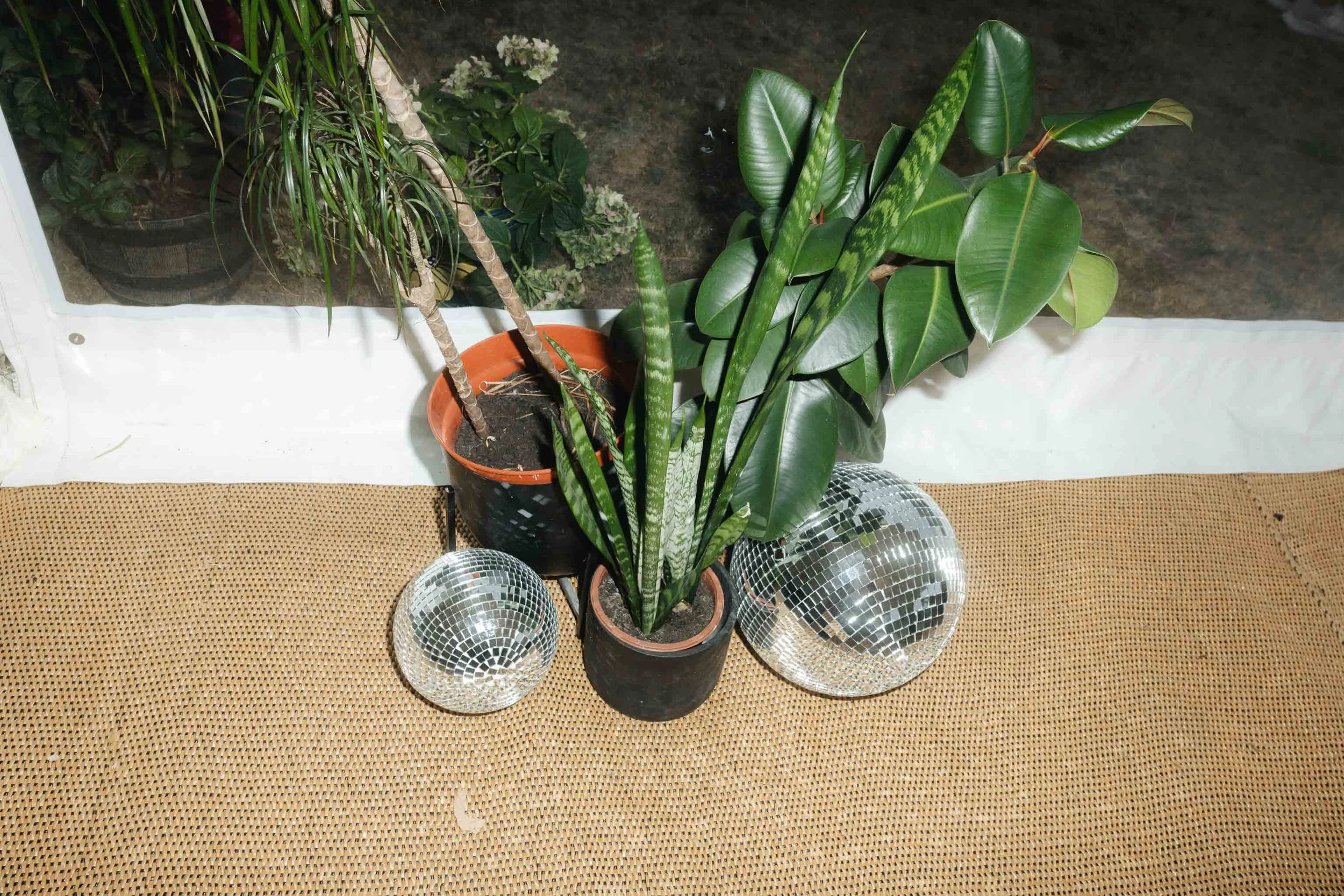  Disco balls on the floor in a wedding marquee. 
