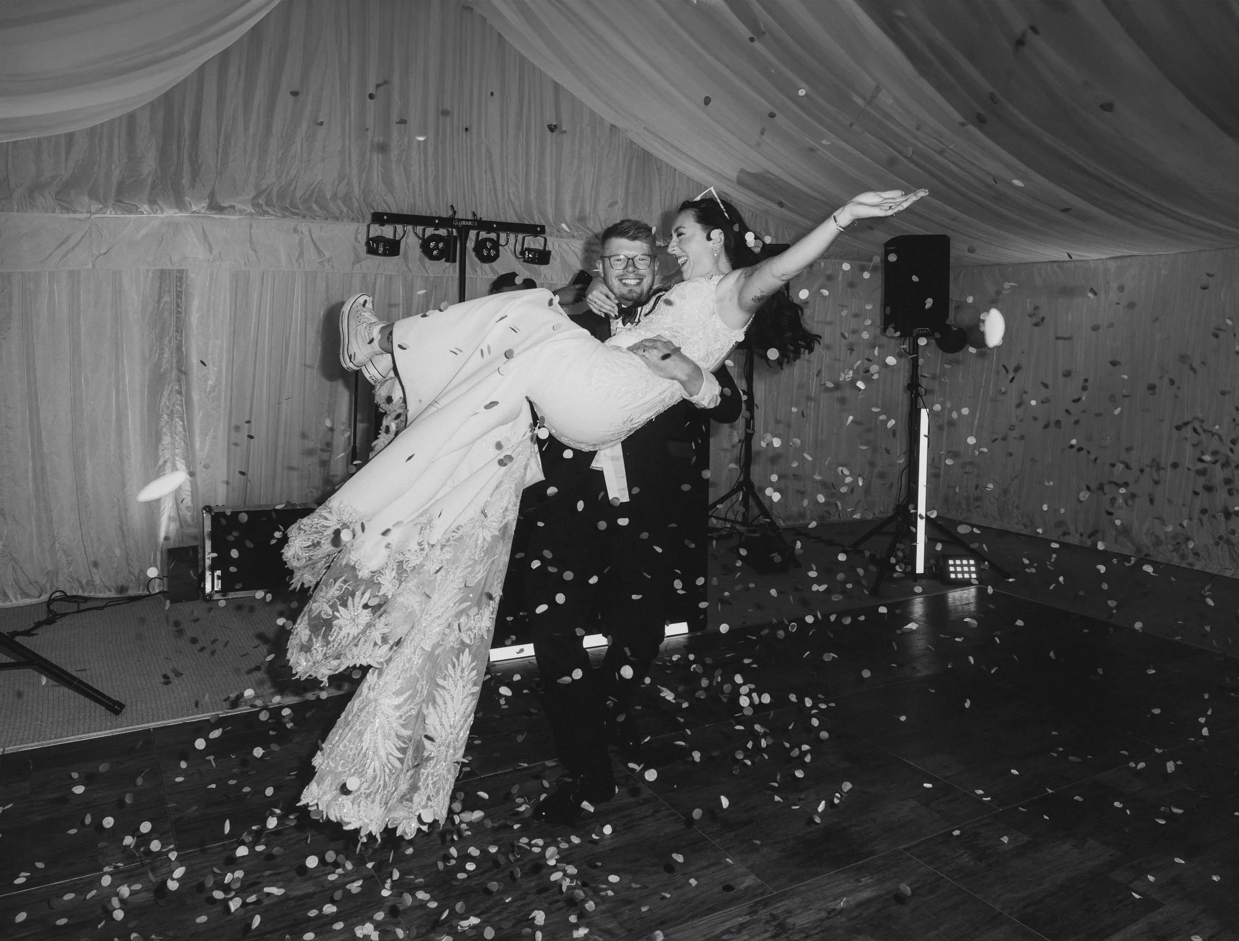  Jess + Oli sharing a spin during  their first dance at marquee wedding reception in Worcester.   