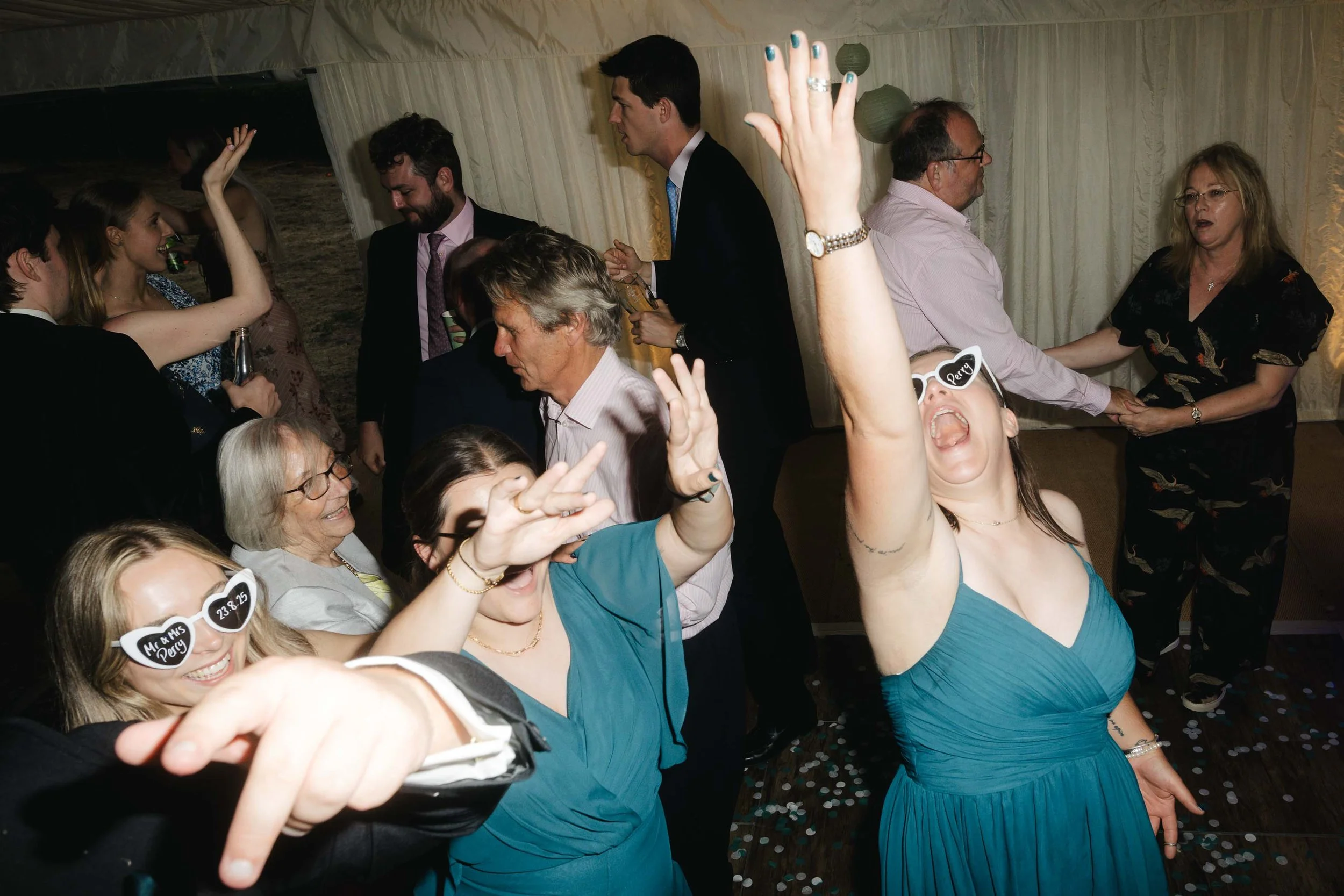  Guests dancing and partying at Jess + Oli’s marquee wedding reception in Worcester.   