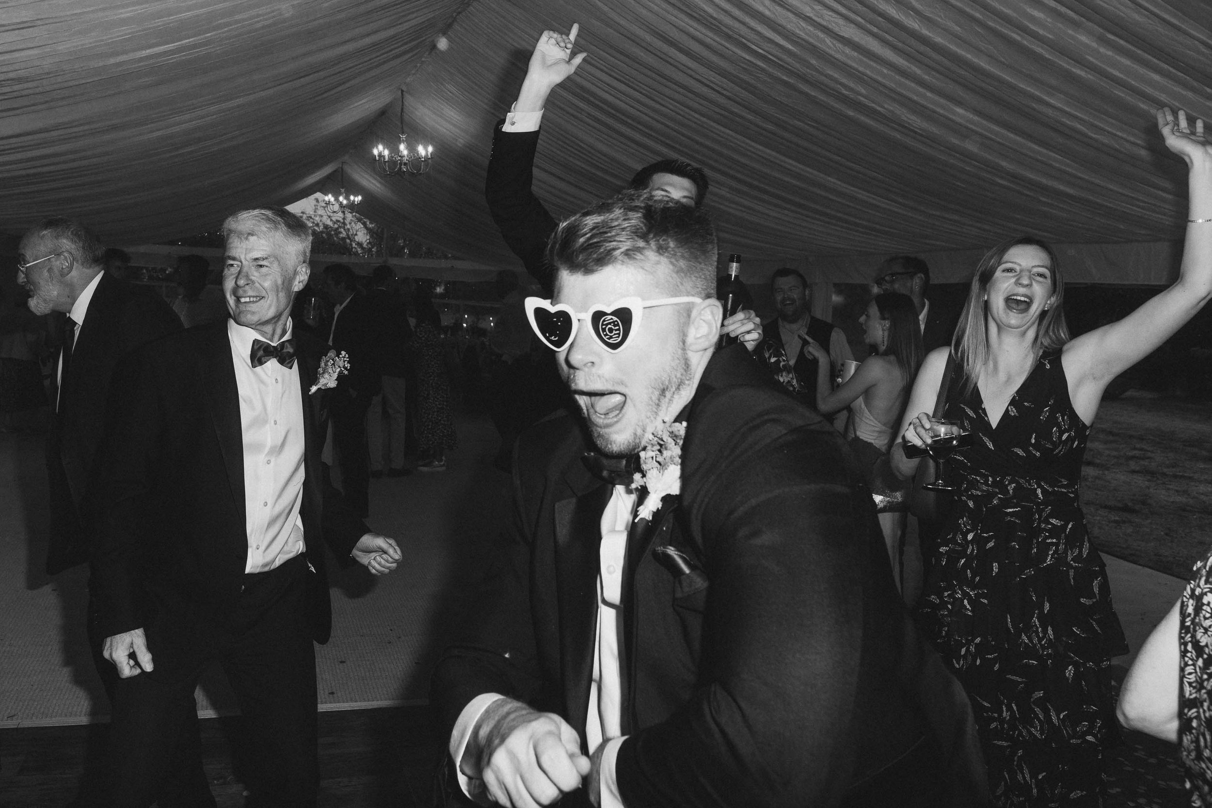  Groom dancing at Worcester wedding marquee reception. 