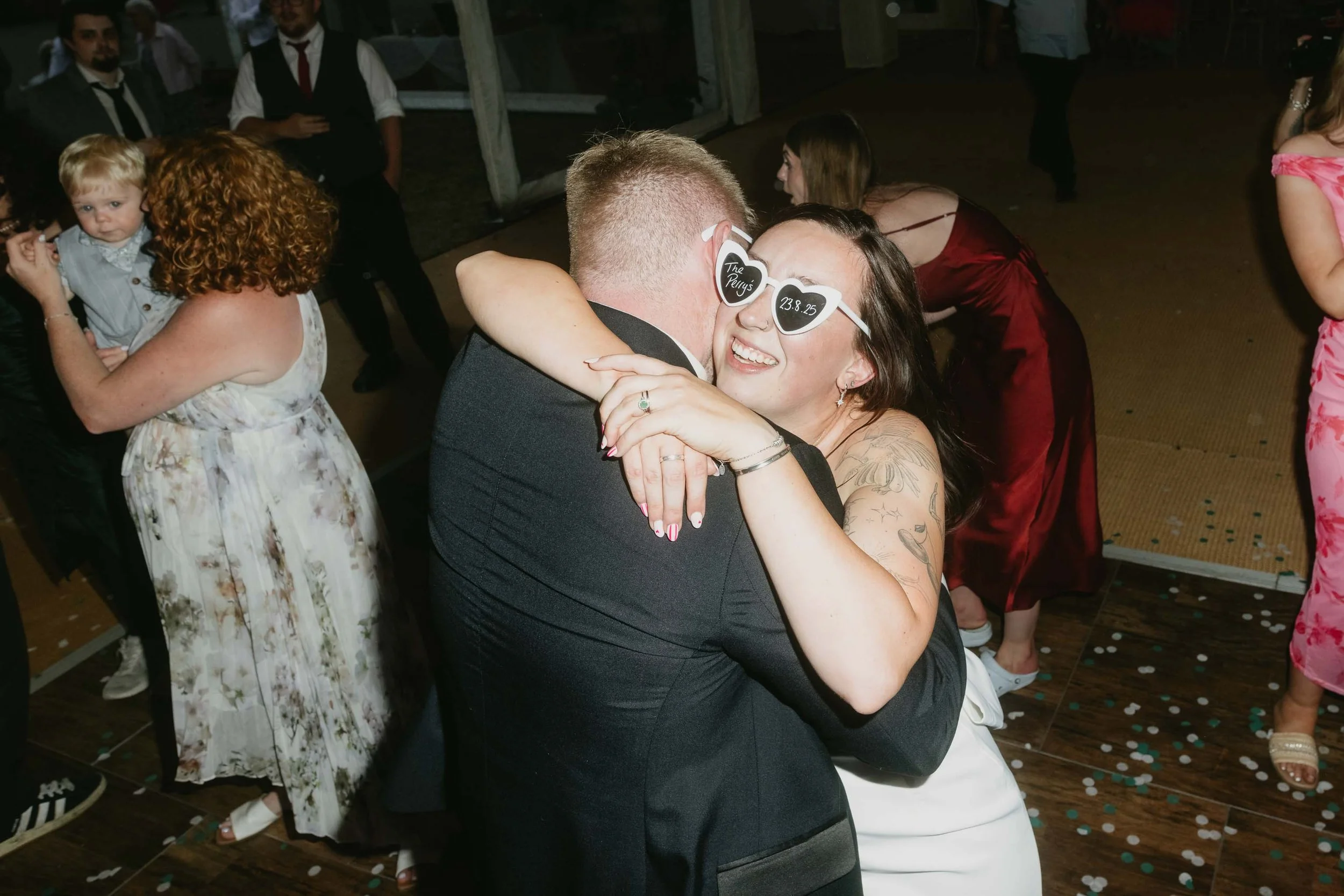  Candid evening dance and hug of bride and groom at Worcester wedding celebration.   