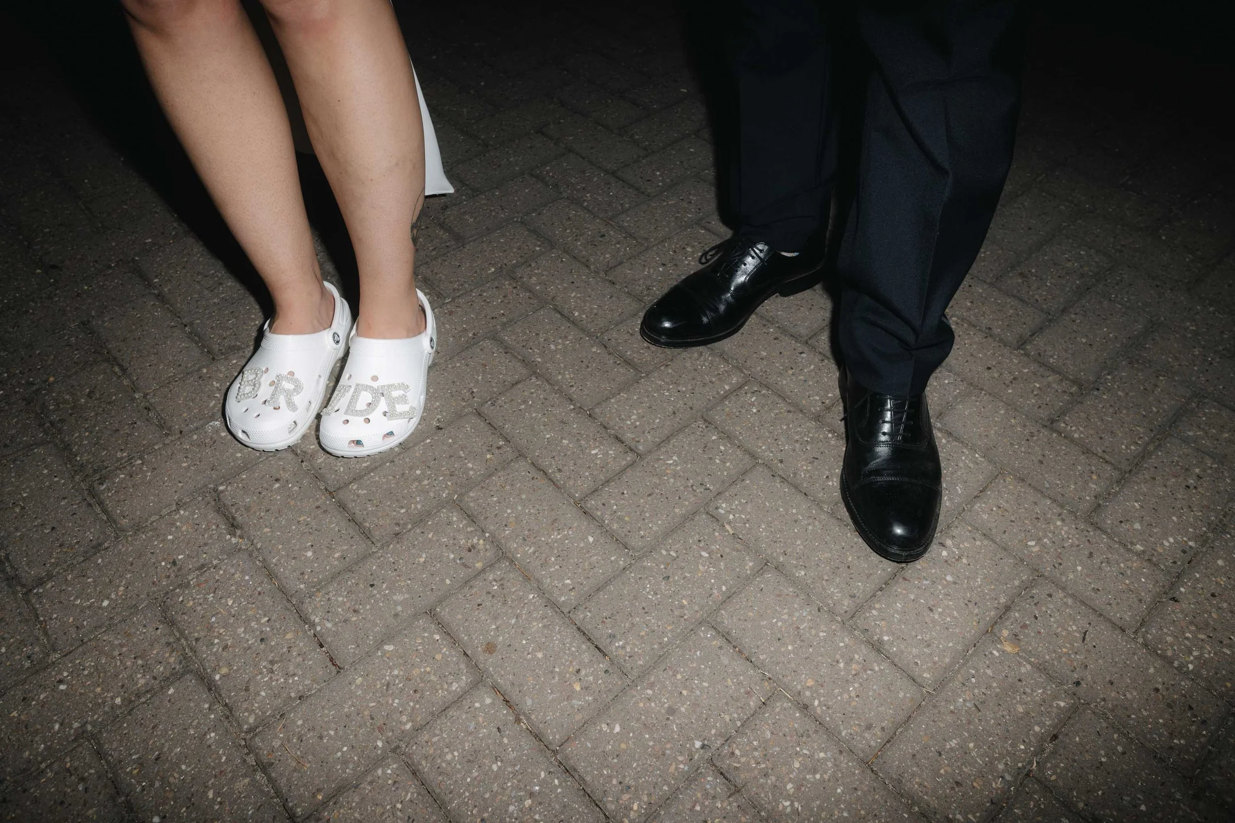  Bride and groom’s shoes in editorial wedding shot at Worcester marquee wedding.   