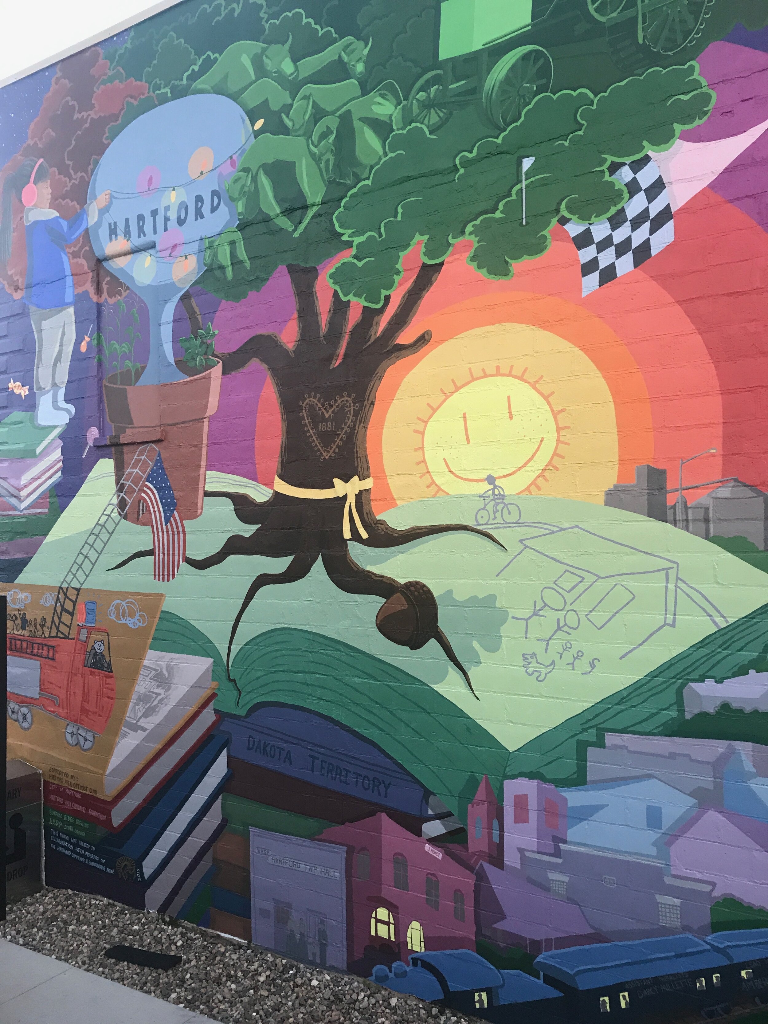 Rooting for HartfordLead Artist: Amber Hansen, Assistant Artists: Darcy Millette &amp; Collin DeBoer, Project Facilitator: Jesse Fonkert,30’ x 30’, Main Street, Hartford, SD. 2019