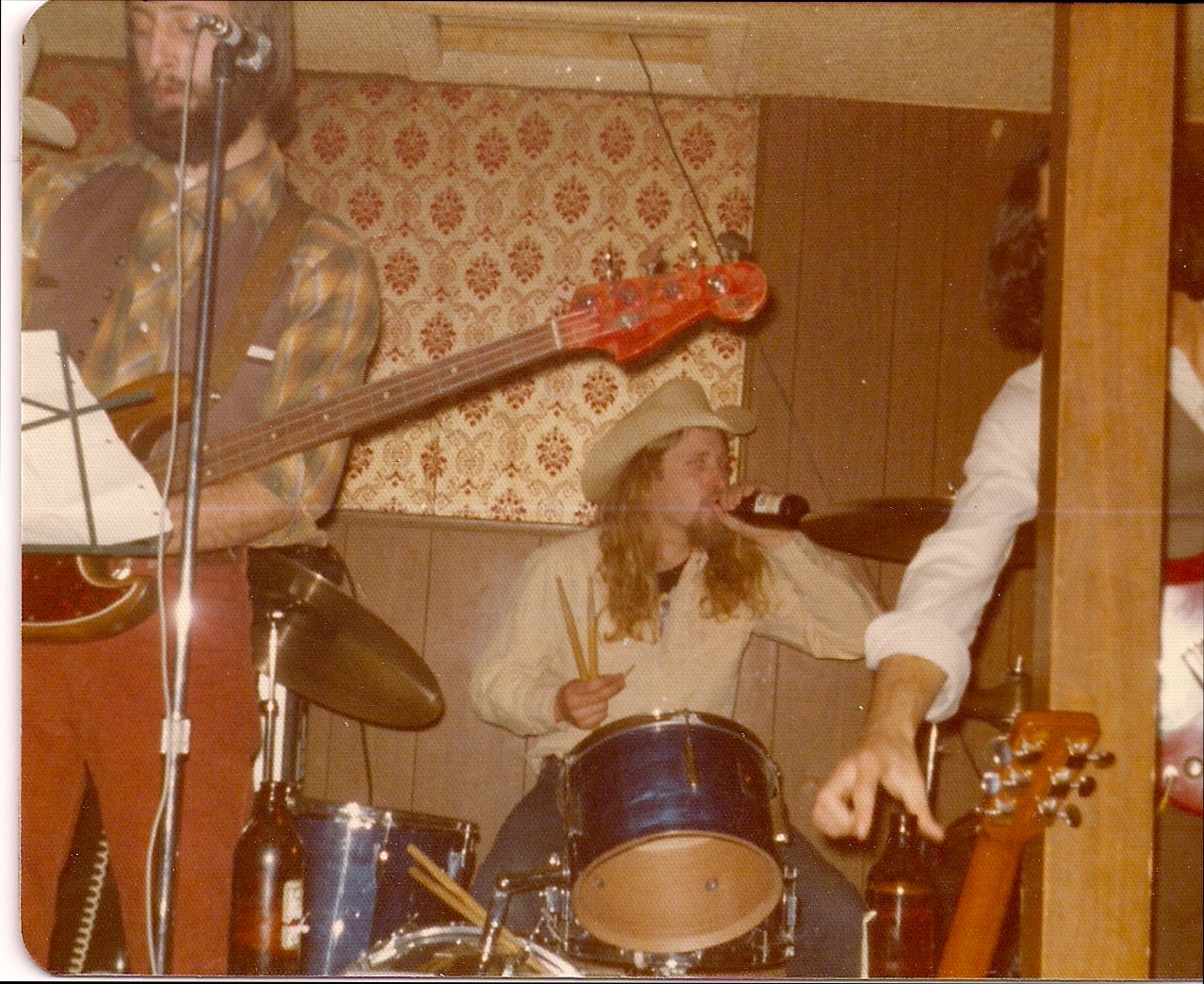 Mike getting refreshed. Jim R on bass.
