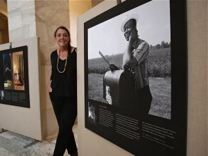 Gail Mooney with a photo from her film on the forgotten Mississippi Delta Blues musicians.