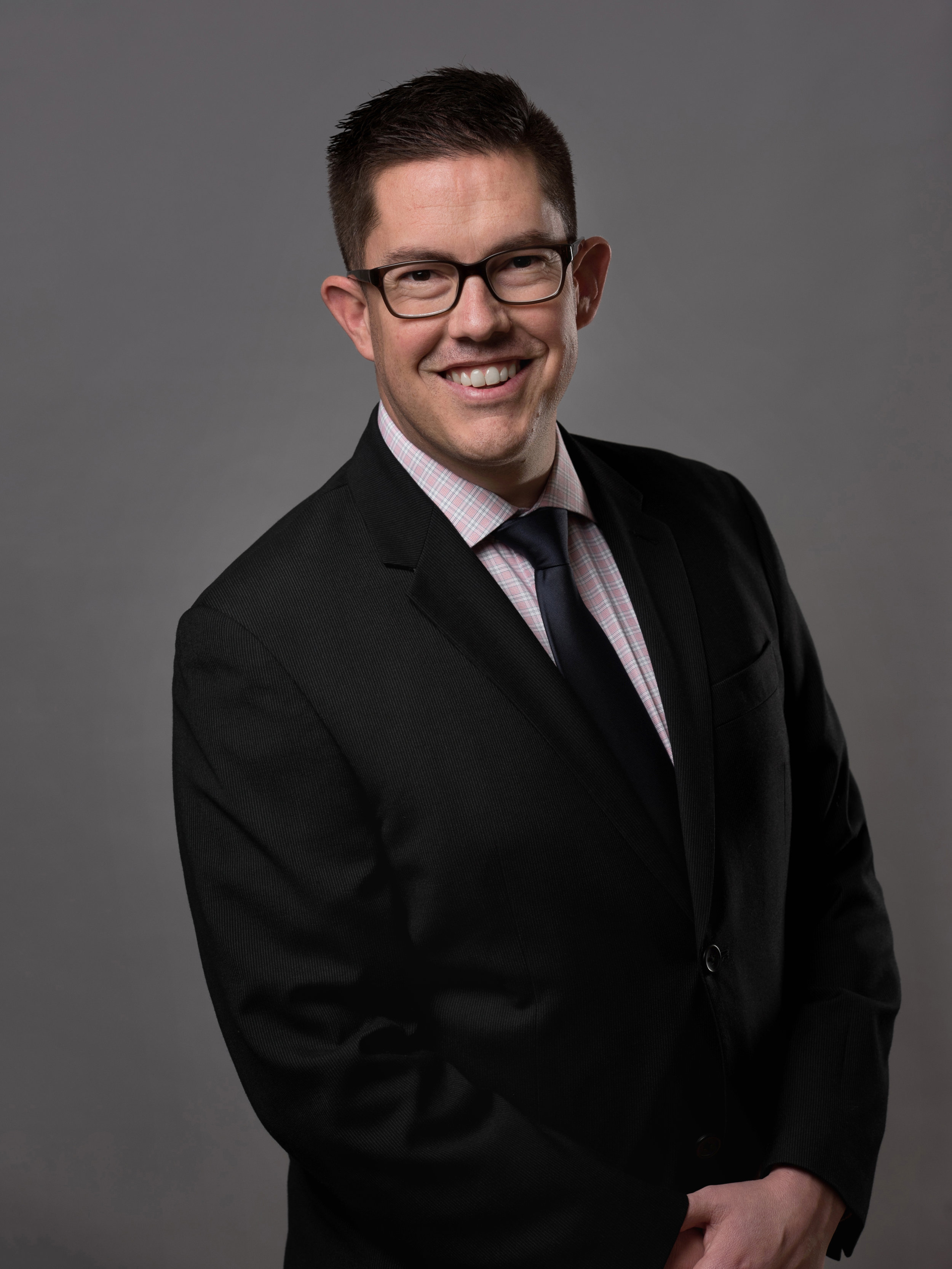 Business portrait of a man using studio light