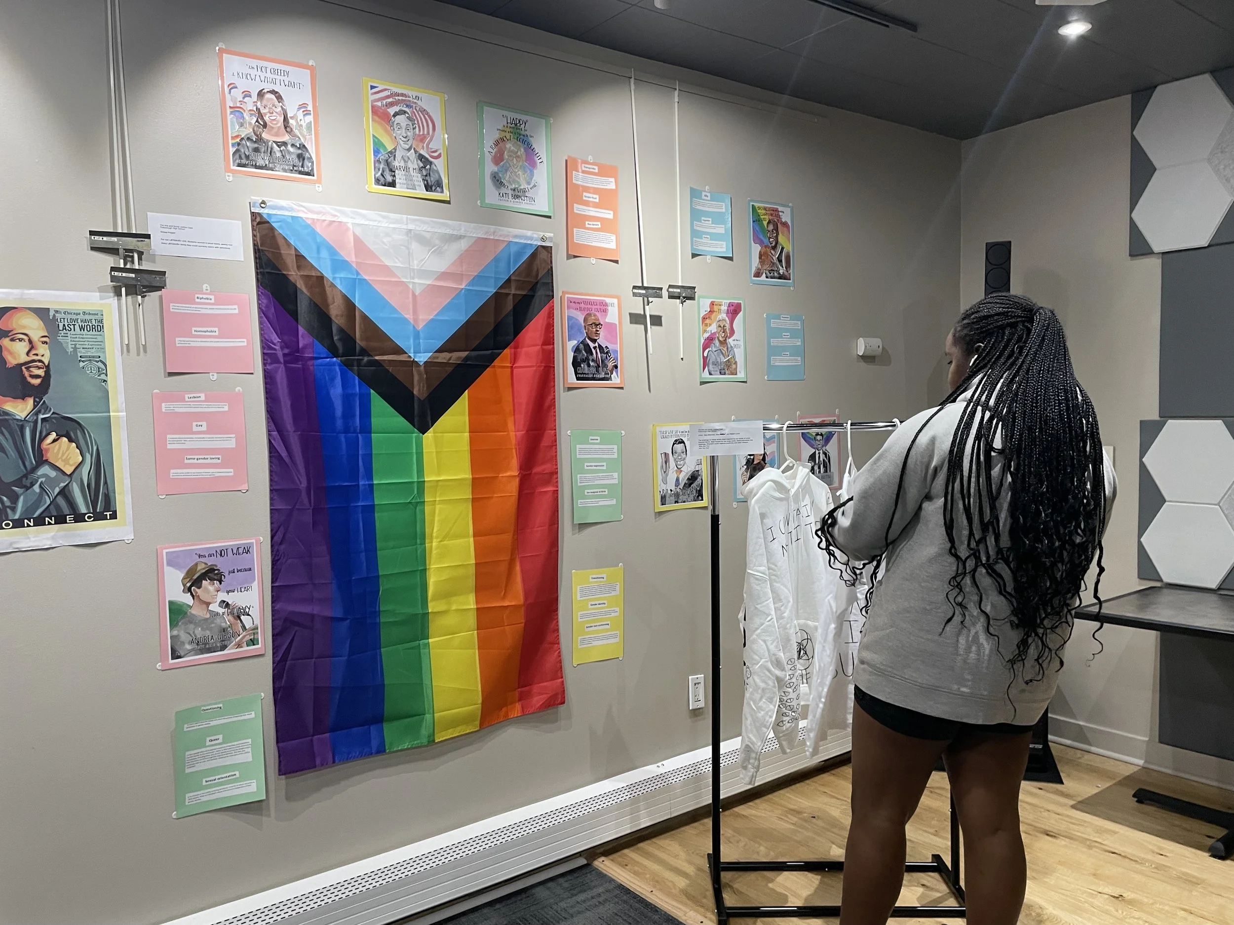 Looking at student work in art exhibit