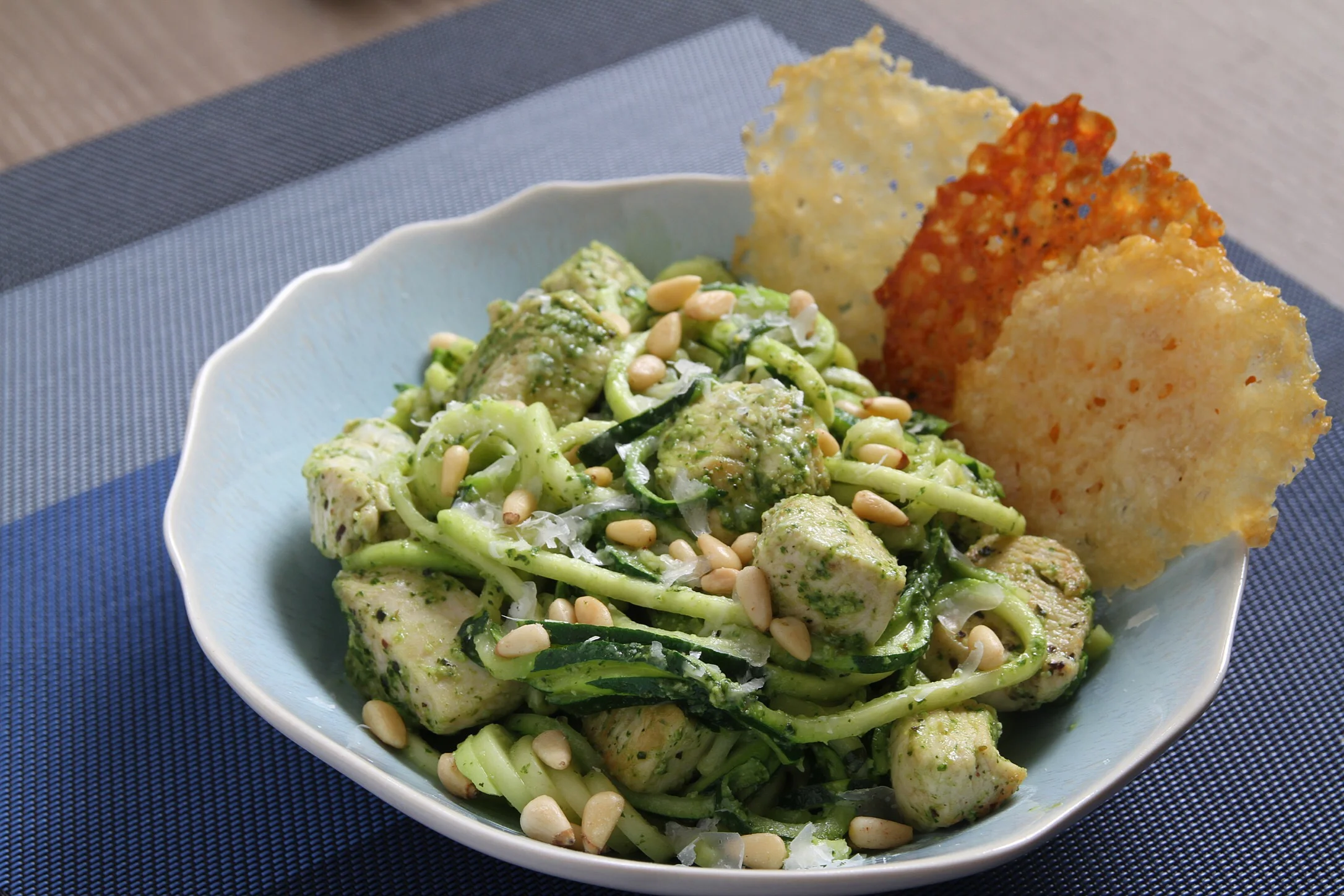 Zucchini noodles with chicken and homemade pesto, and Parmesan crisps. 