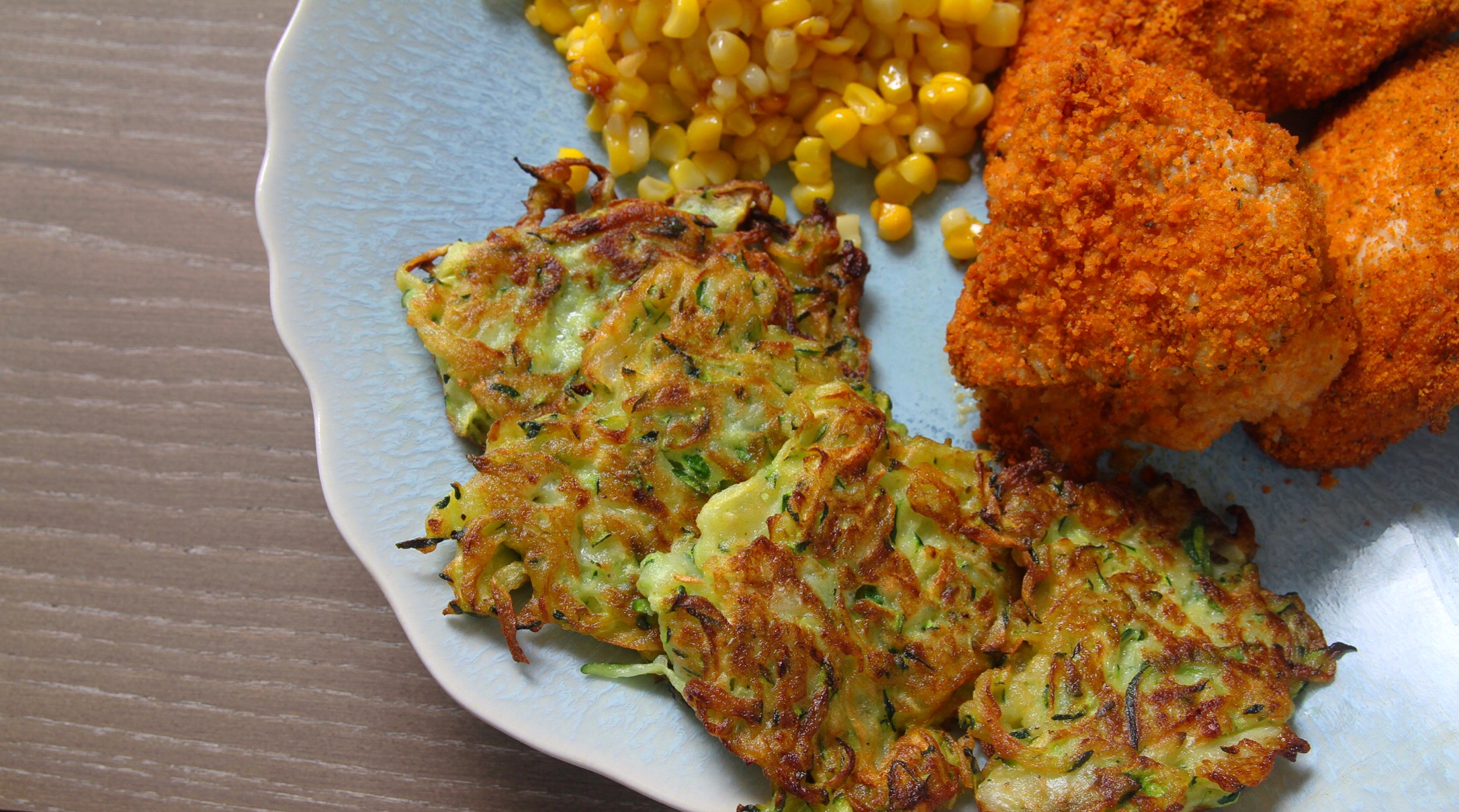 Zucchini fritters with corn and crispy baked chicken.