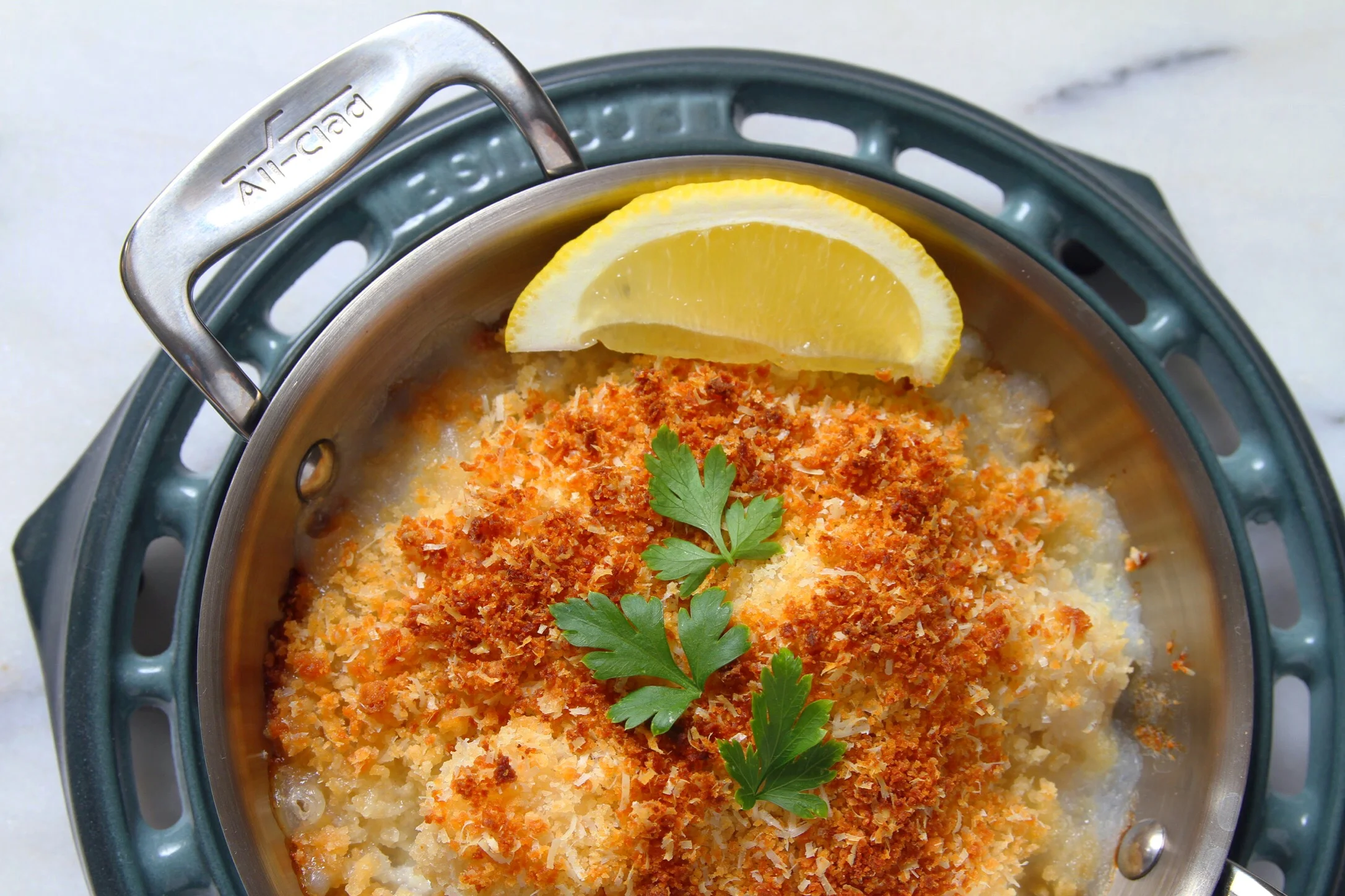 Baked scallops with Panko breadcrumbs, parsley, and lemon. 