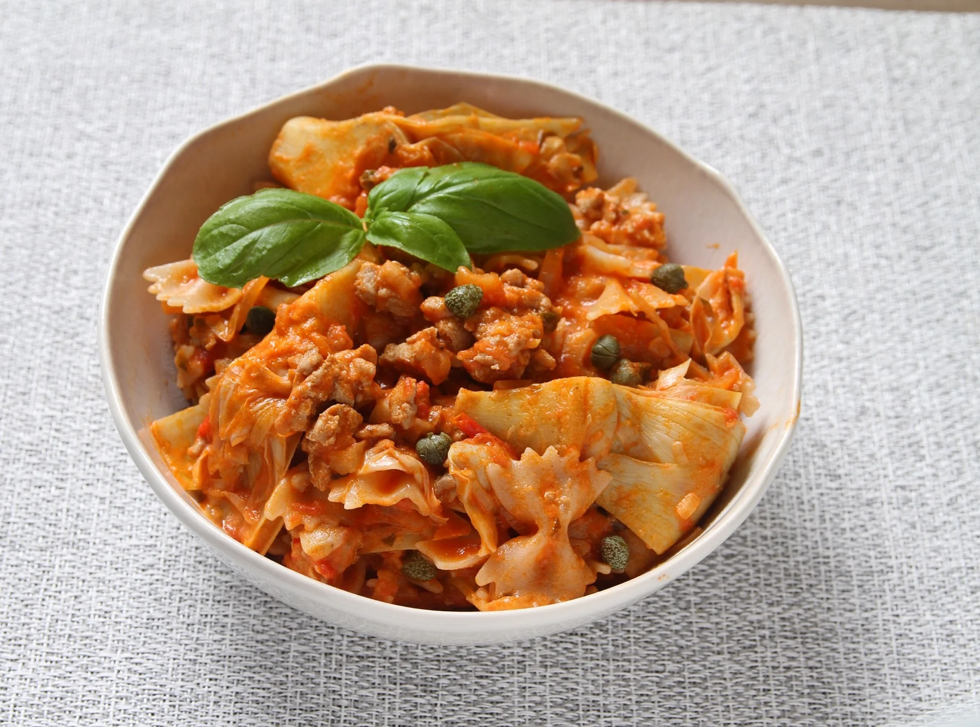 Turkey meatsauce with GF farfalle, artichokes, capers, shallots, onion, and a little cream. 