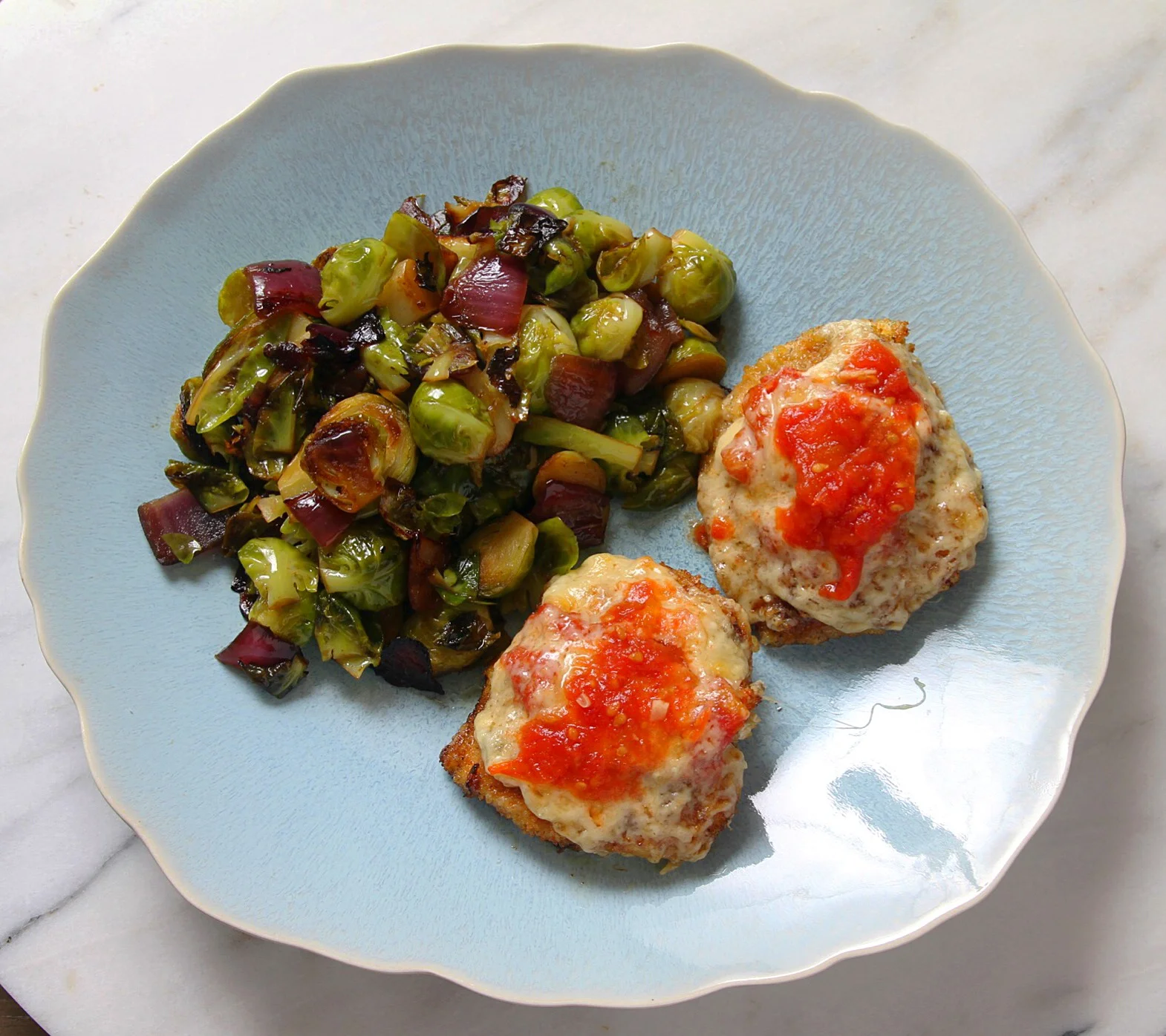 Brussels sprouts with homemade chicken Parmesan. An odd, but uniquely delicious, pairing.&nbsp;