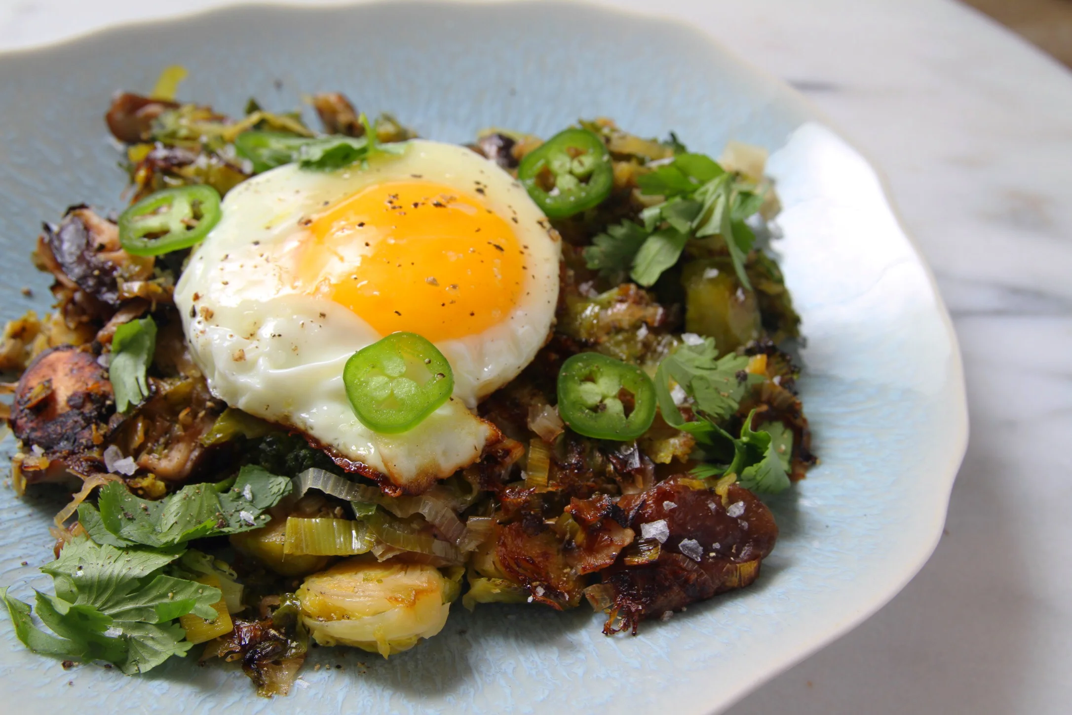 Winter vegetable hash with jalapeños and fried eggs