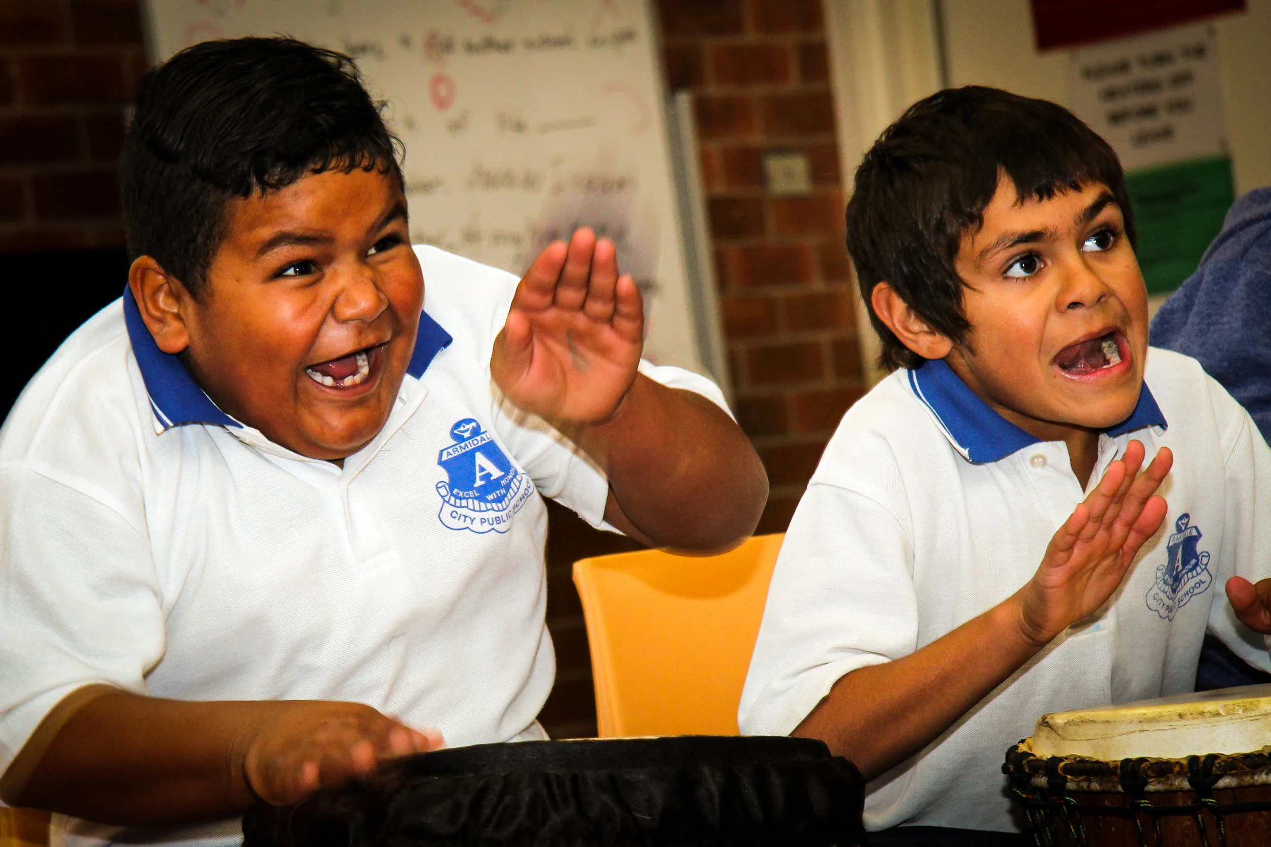 Boys playing djembe.jpg