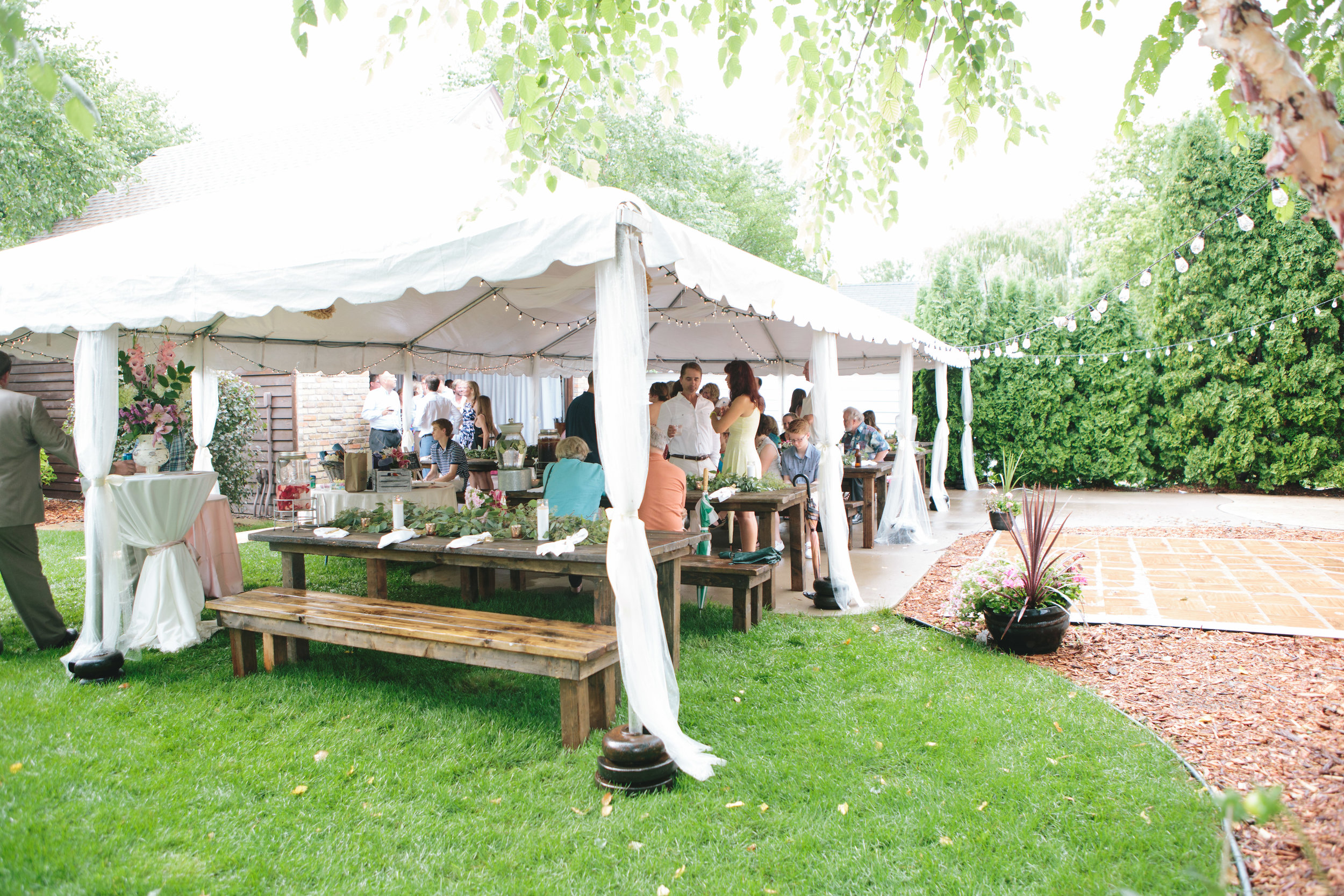 tented wedding reception, prepare for rain on wedding day, wedding string lights, backyard wedding reception inspiration