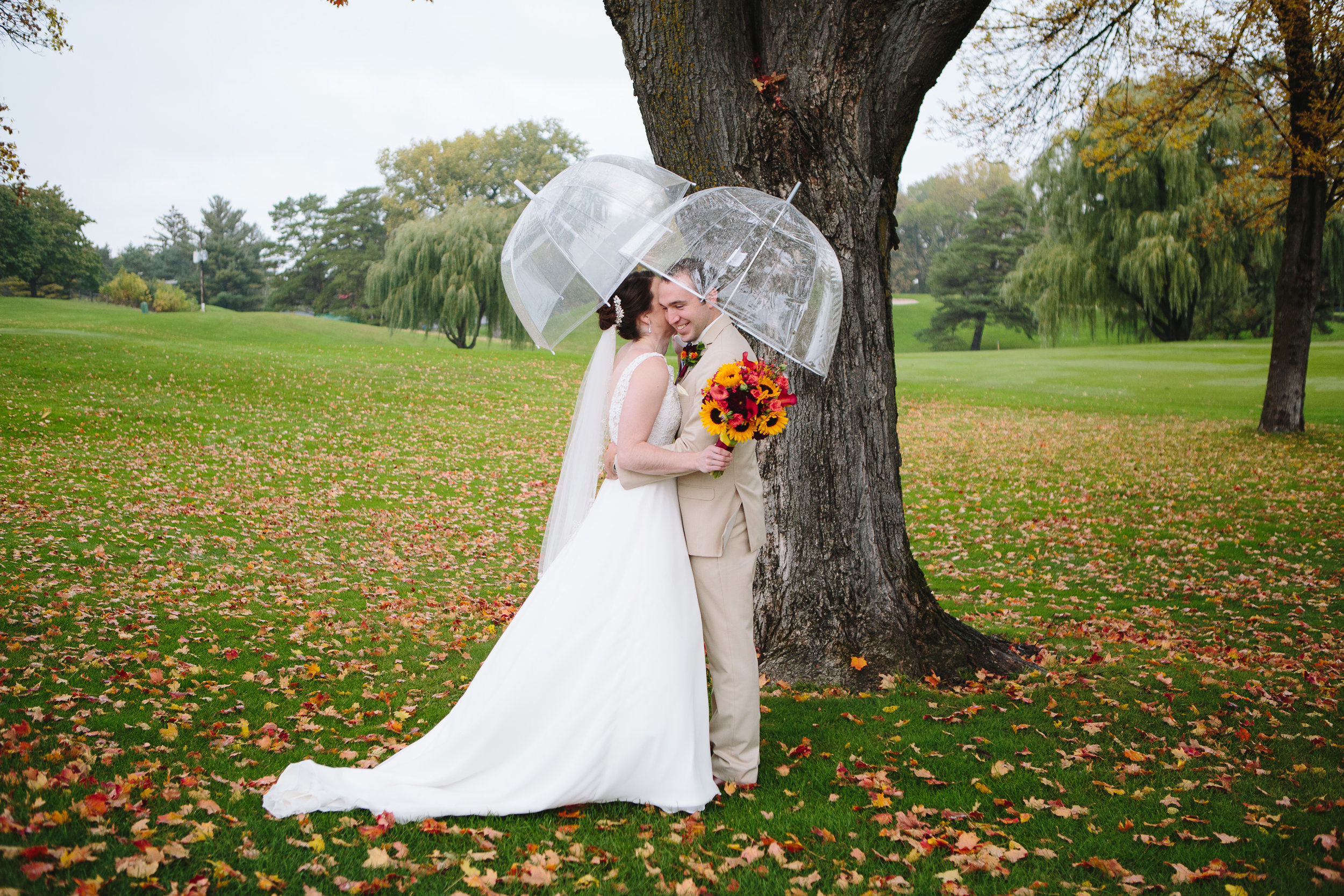 rainy wedding day, fall wedding, October wedding photography, prepare for rain on your wedding day, umbrella wedding photos, golf course wedding photos, candid romantic wedding photos