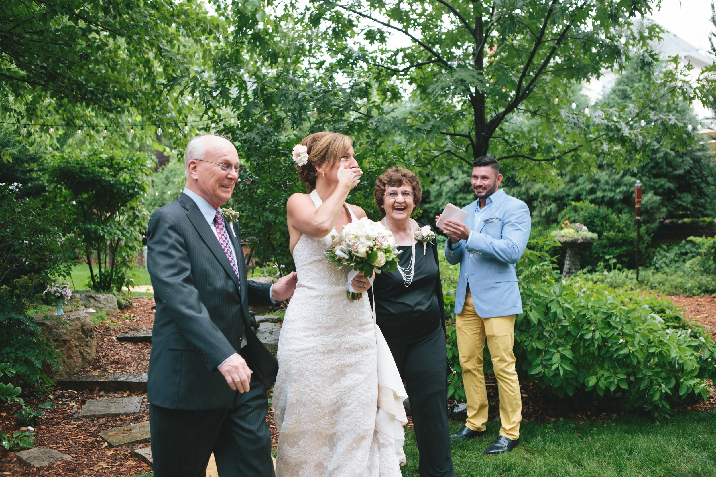 prepare for rain on wedding day, lace wedding dress, backyard wedding inspiration, candid wedding photos