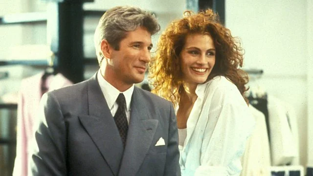 PRETTY WOMAN: A man in a legal but hurtful business needs an escort for some social events, and hires a beautiful prostitute he meets...only to fall in love.