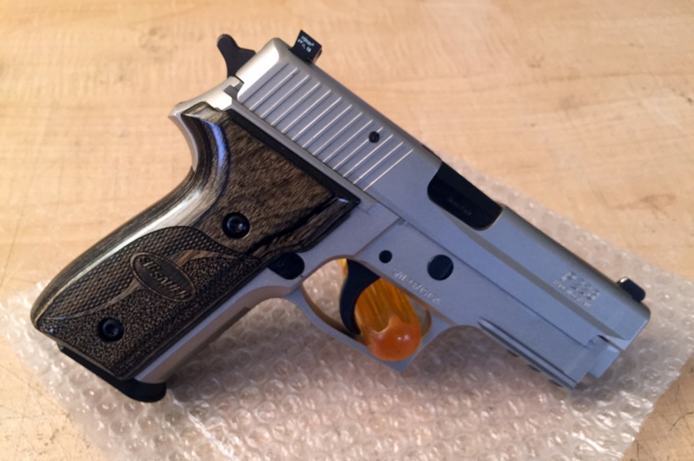 Very nice frame examples - both the frame and slide were plated with electroless nickel, finished off with black accents and controls, Trijicon night sights and Sig Equinox Blackwood grips with Torx screws. "I couldn't have done it without you guys' help! The tools made it a breeze and the parts were all top quality even though they were reconditioned."