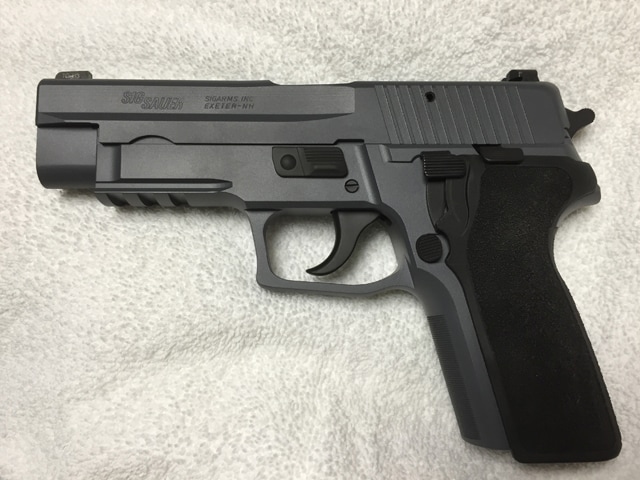 A P226 slide on our 229, Cerakoted Sig Dark Gray by MSG limited, modified E2 grip kit.