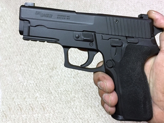 "The slide and frame are Cerakoted with Graphite black, all the other components are coated in Armor black. I added an SRT kit and with a little modifying I was able to fit a P229-E2 grip onto the frame perfectly. "