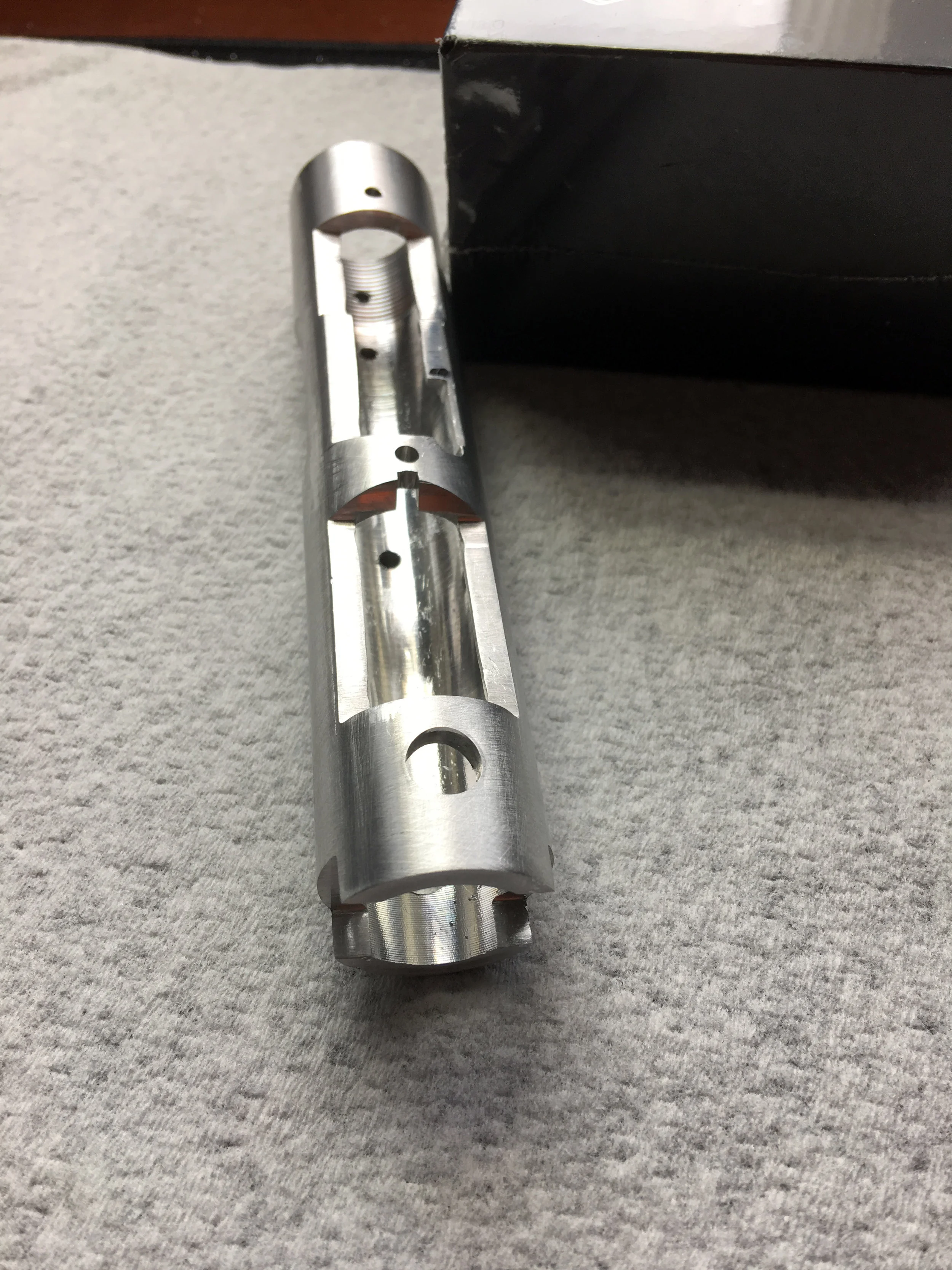 “Hello, I figured I’d send some pics of my first attempt with the jig. I’m pretty happy with the results and I think it’ll work. I might have to do a little more filing on bottom cuts but it’s very close to the templates. I’m gonna order a couple more tubes once the parts kits are done. You did a great job on the jig. Thanks. I used the brownells file I have that I used on a 1911 slide that didn’t have the sights cut on the slide. It works really good for dovetail cuts. It’s amazing what can be done with some good files and thanks to the hardened steel on the jig I’m sure I can do a bunch more receivers without effecting the dimensions of the jig. The barrel threading came out great because of your jig.