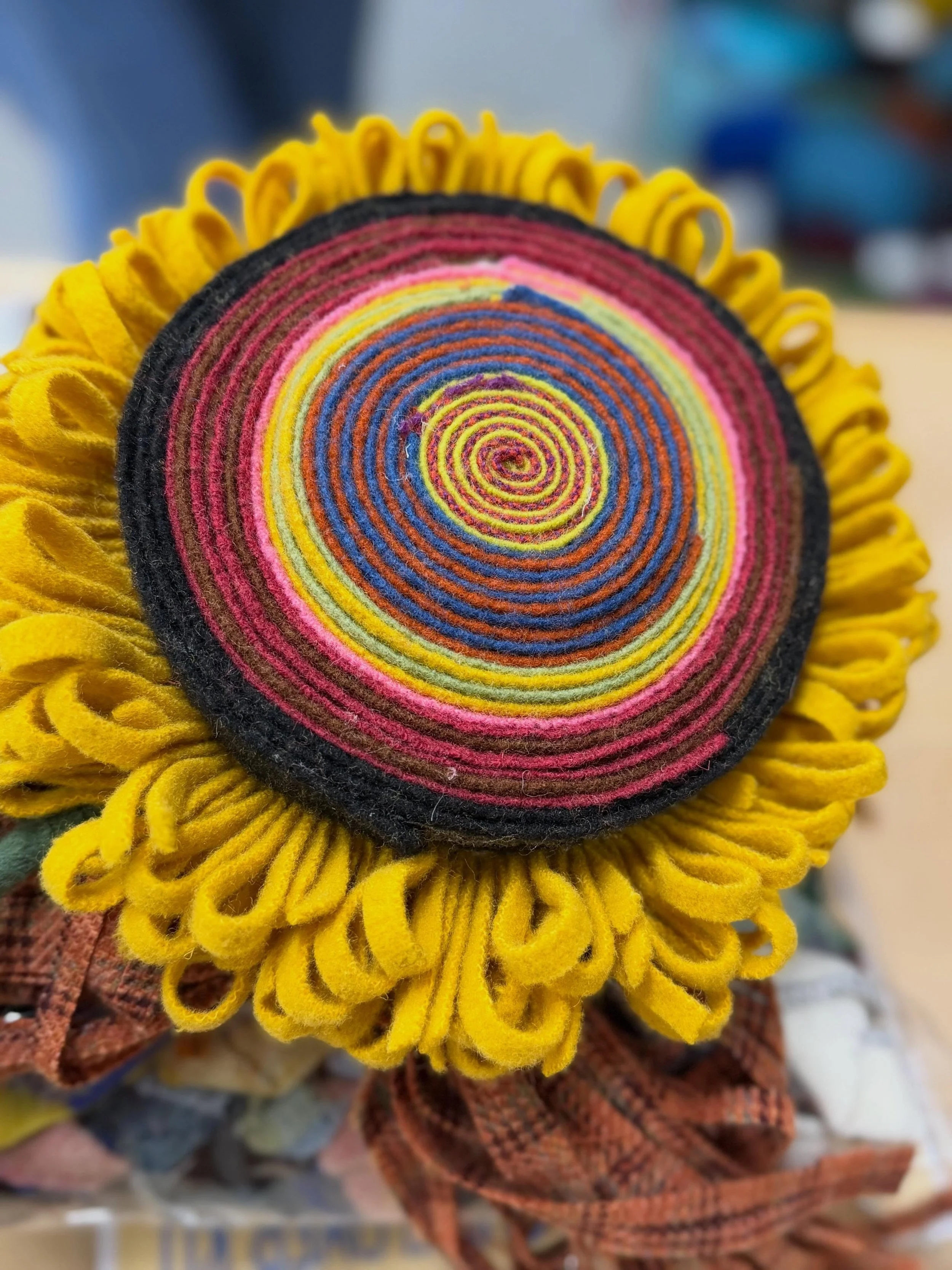 Four beautiful giant sunflowers from our class this morning. Fun times! #rughooking #feltflowers #sunflowers #fiberart #textileart