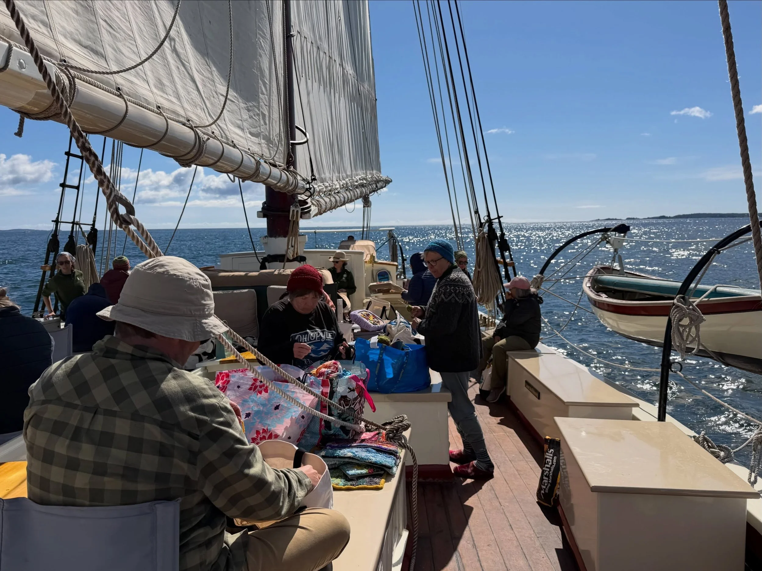 What an excellent day for rug hooking aboard the @schoonerriggin today in mid-coast Maine! We are working small, abstract, quickly, and with mixed materials! Thanks for being game to try something so non-traditional, sailors! Thanks to @207creatives 
