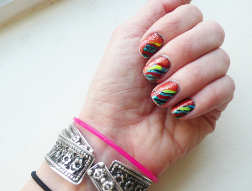 I just went crazy last night like a 4th grader with some puffy paint and a poor, poor My Little Pony who found himself on the wrong craft table at the wrong time.
Here’s how this went down:
- Base is Incoco Urban Jungle blue glitter zebra nail “stickers” - Rainbow madness is random fluorescent pink, yellow and Revlon Siren (coral) - Topcoat is Deborah Lippman gold glitter from this Juicy Couture set
So … sometimes it’s just about playing and going nuts, I guess.
If you have any respect for me after this, did want to let you know you can now shop almost all my product recommendations in one place over on my
Currently Obsessed.me page !
The site is still invite-only but I have about 100 you can use, just enter Holier_than_NowObsessed when you’re bounced to the login page.
There are fashion finds on there too from my other blog Holier than Now .