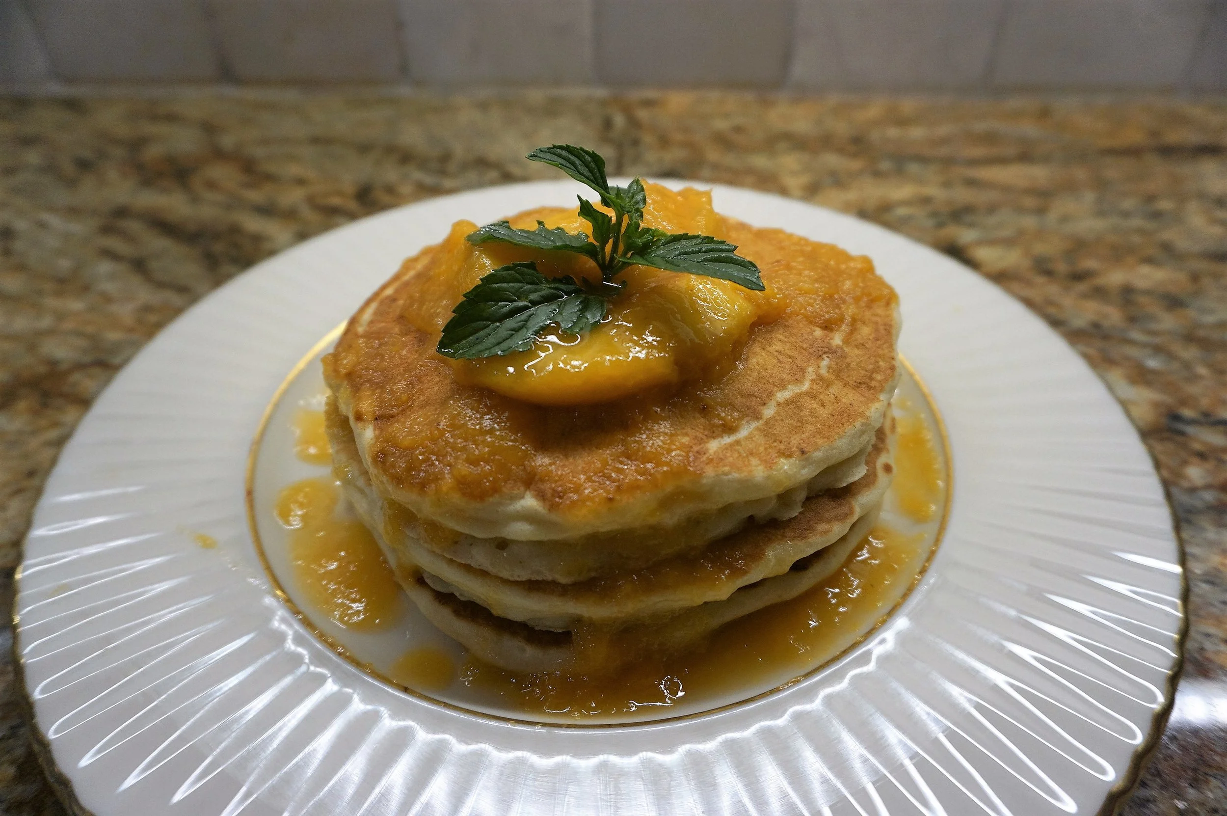 Buttermilk pancakes with peach caramel sauce