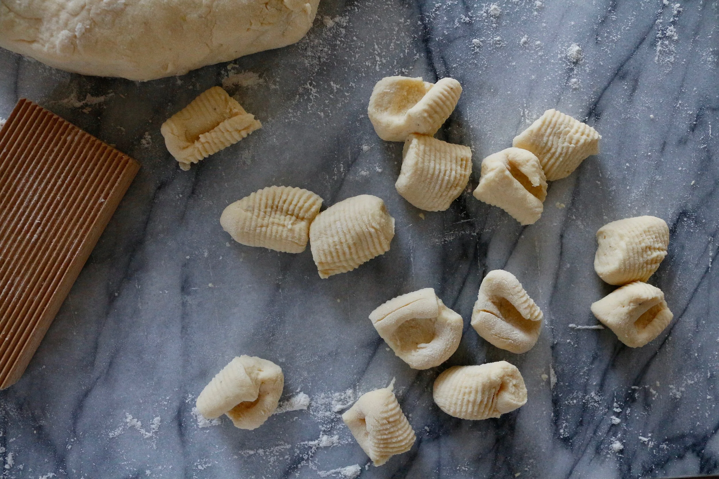 Ricotta gnocchi to be served with the works: a big pot of sauce, sweet Italian sausage, meatballs, garlic bread, Caesar, and the tiramisu cake pictured earlier. Perfection.