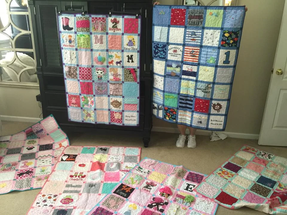 The baby outfit quilts I had made for all six of my biological children. Since I decided to do this only a few years ago, I did mix some then toddler clothes in with my older children's quilts. I also had a quilt made of my husband's professional baseball shirts.