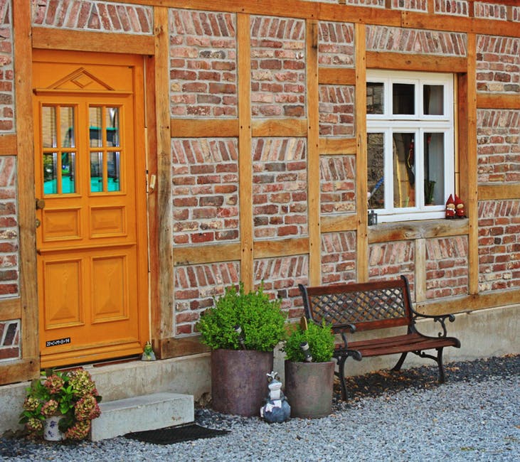 3. Take a good look at your front door. Pull out the struggling begonia blooms and wilted geraniums who could no longer take the heat, and replace them with chrysanthemums in a variety of fall colors, sunflowers, or crotons all of which sport the rich warm colors associated with fall.