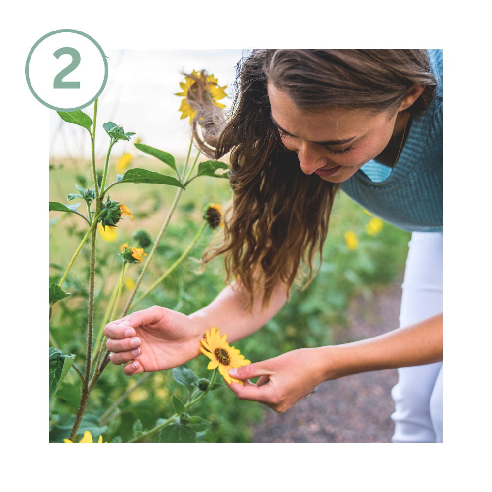 Woman connecting with nature as part of a holistic wellness practice