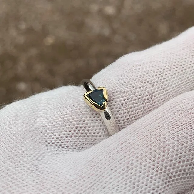 Blue tourmaline set in gold with a silver band. This was a custom for a friend 🙏🏻💎