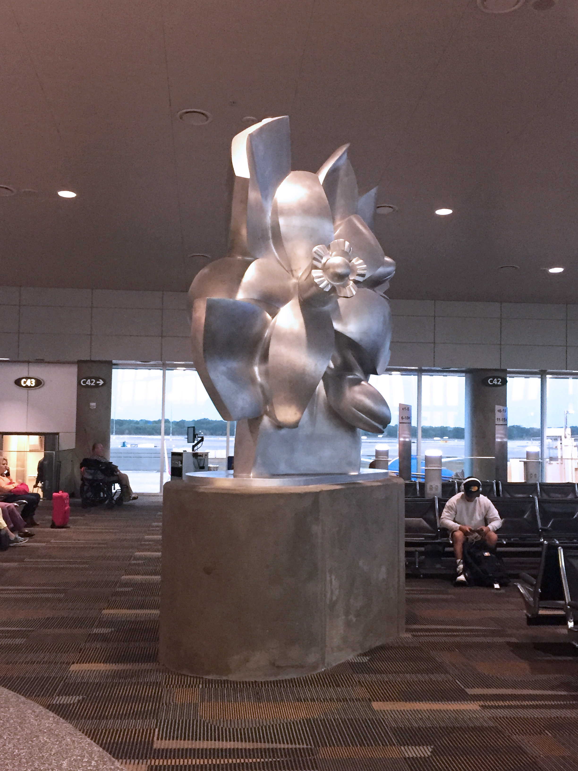  Orange Blossom sculpture relocated on Airside C. &nbsp;New base was required for the of the &nbsp;Art Program 