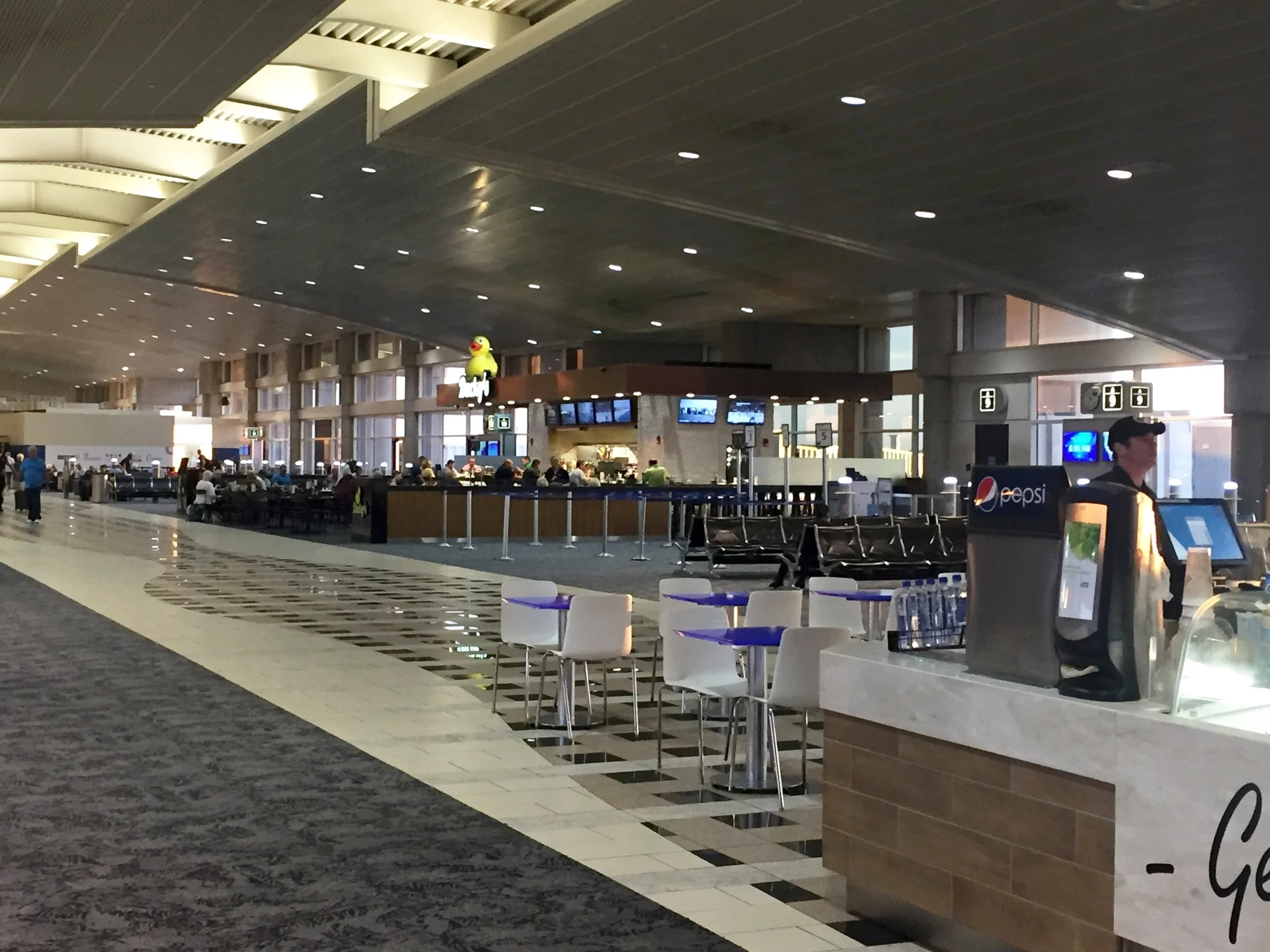  Airside A newly developed area, original smoking area enclosure. Preserving the flow of the concourse was essential to the design. Element Photos 2017. 