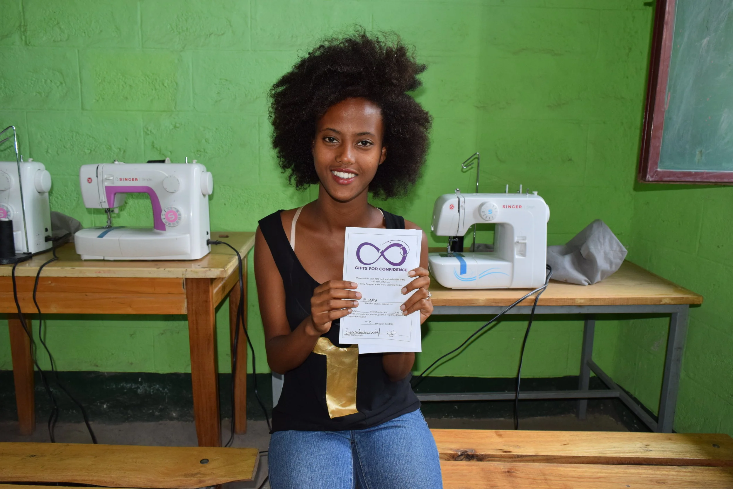 Misgana receiving her payment