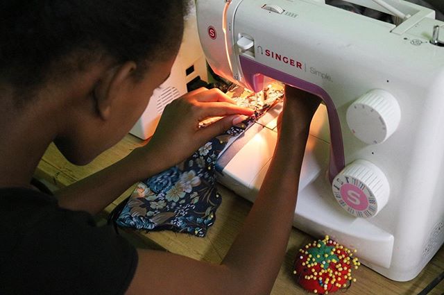 It's all in the details! Our girls work with pins to ensure straight stitches. Continue supporting their education by donating at https://www.giftsforconfidence.org/donate