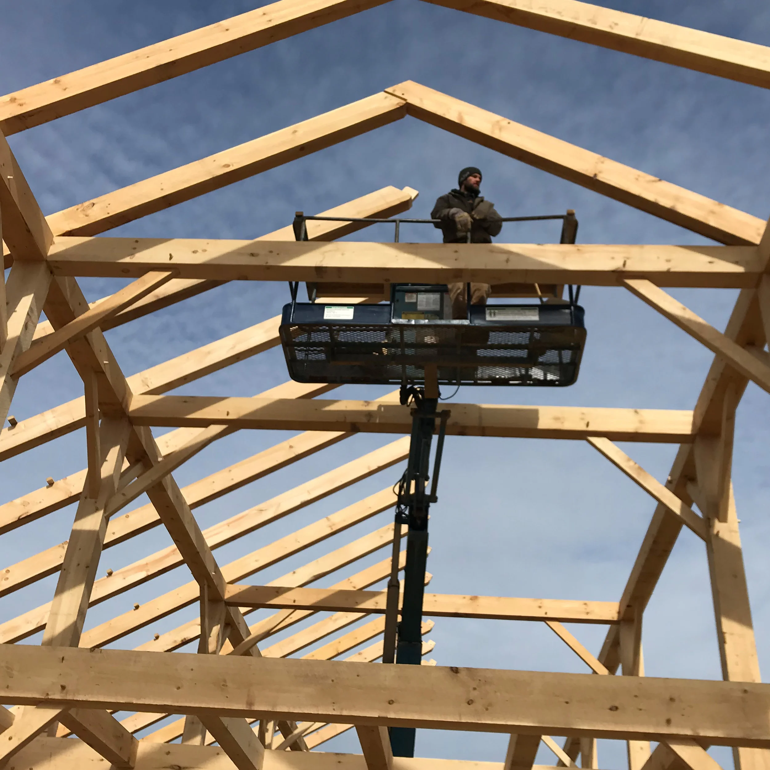 Timber frame in manlift.jpg