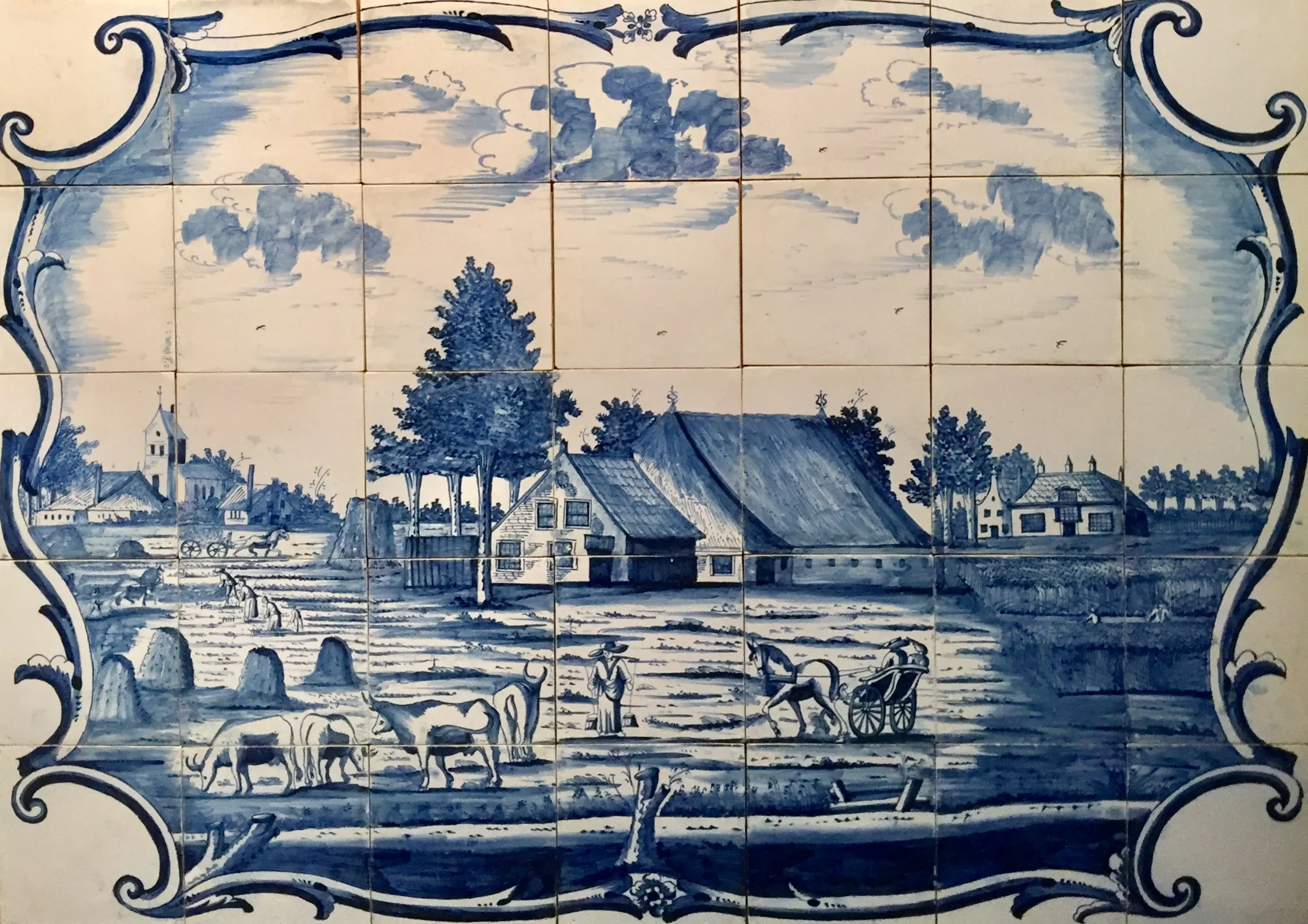 A Dutch Friesian landscape painted with cobalt like the Delft Blue ware.